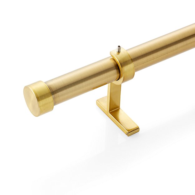 The High/Low List by Nadine Stay - Featuring Brass Accents. High end pieces and their (cheaper) twins. Brass home decor, furniture, and accessories. Brass Curtain Rod from Crate & Barrel..