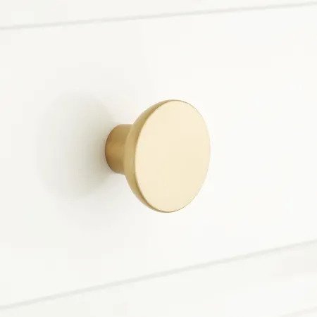 The High/Low List by Nadine Stay - Featuring Brass Accents. High end pieces and their (cheaper) twins. Brass home decor, furniture, and accessories. Brass circle knob from Signature Hardware.
