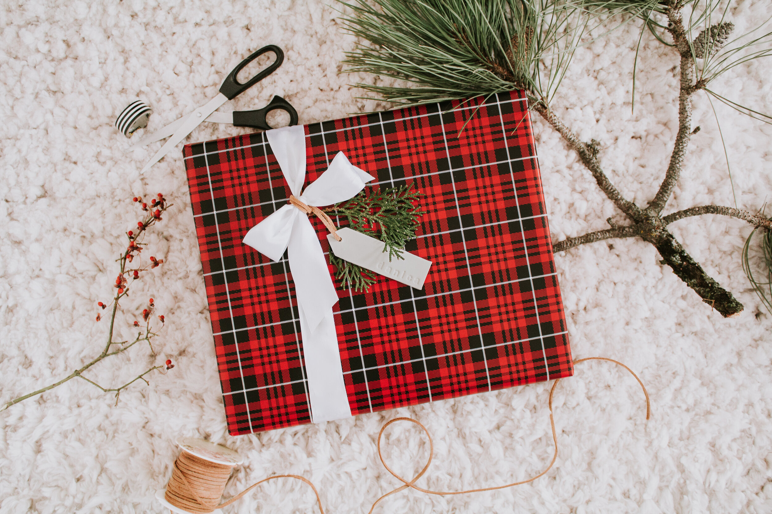 The High/Low List by Nadine Stay - Christmas Edition. Candlesticks, stockings, wrapping paper, slippers, Christmas trees, and tree collars. Look-alike Christmas essentials for less.