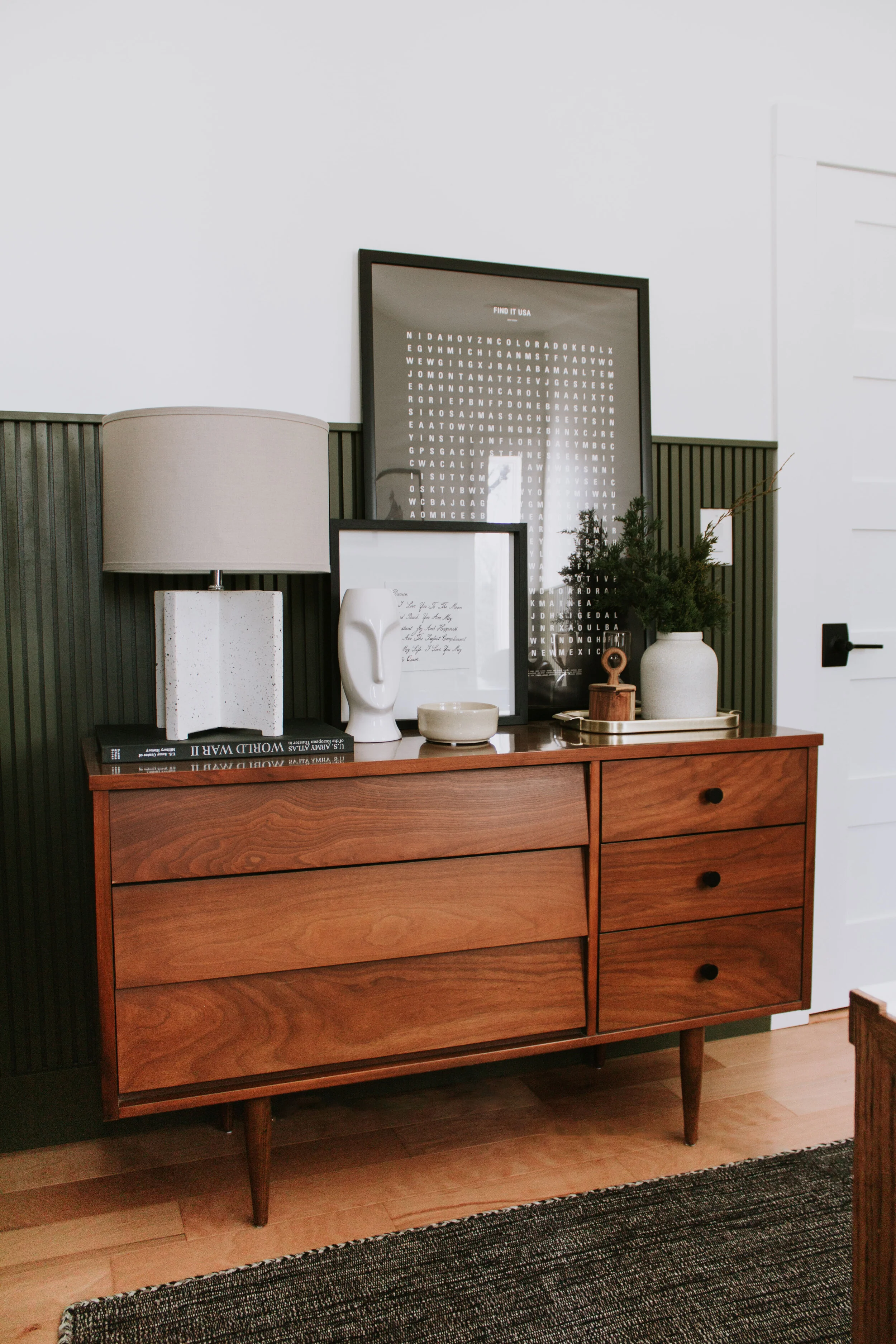 Home Office Makeover Reveal - our bedroom and office before and after transformation. We turned this basic room into an office oasis! Modern hunter green wainscoting, floor to ceiling curtains, and a waterfall desk. It's a modern office dream by Nad…