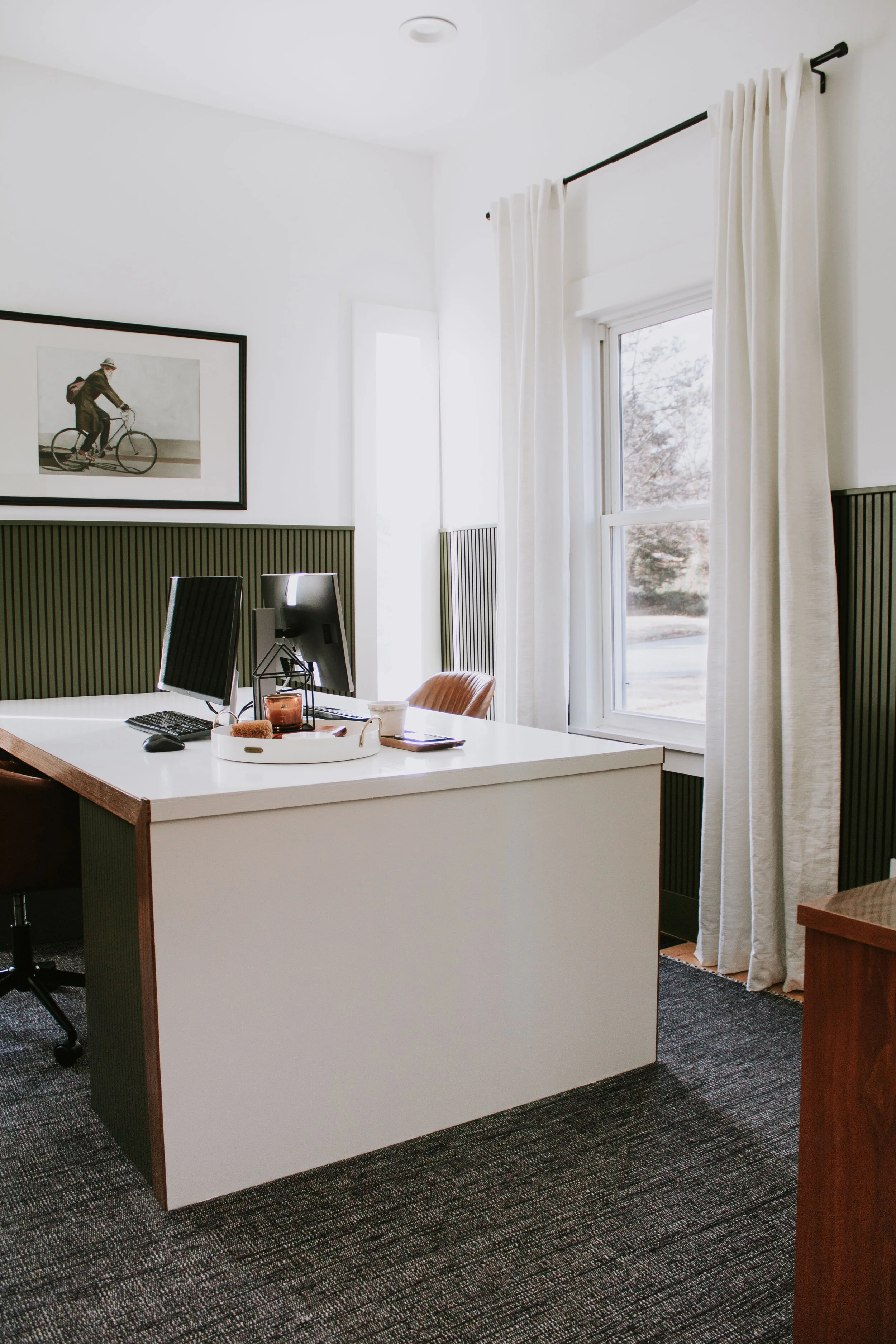 Home Office Makeover Reveal - our bedroom and office before and after transformation. We turned this basic room into an office oasis! Modern hunter green wainscoting, floor to ceiling curtains, and a waterfall desk. It's a modern office dream by Nad…