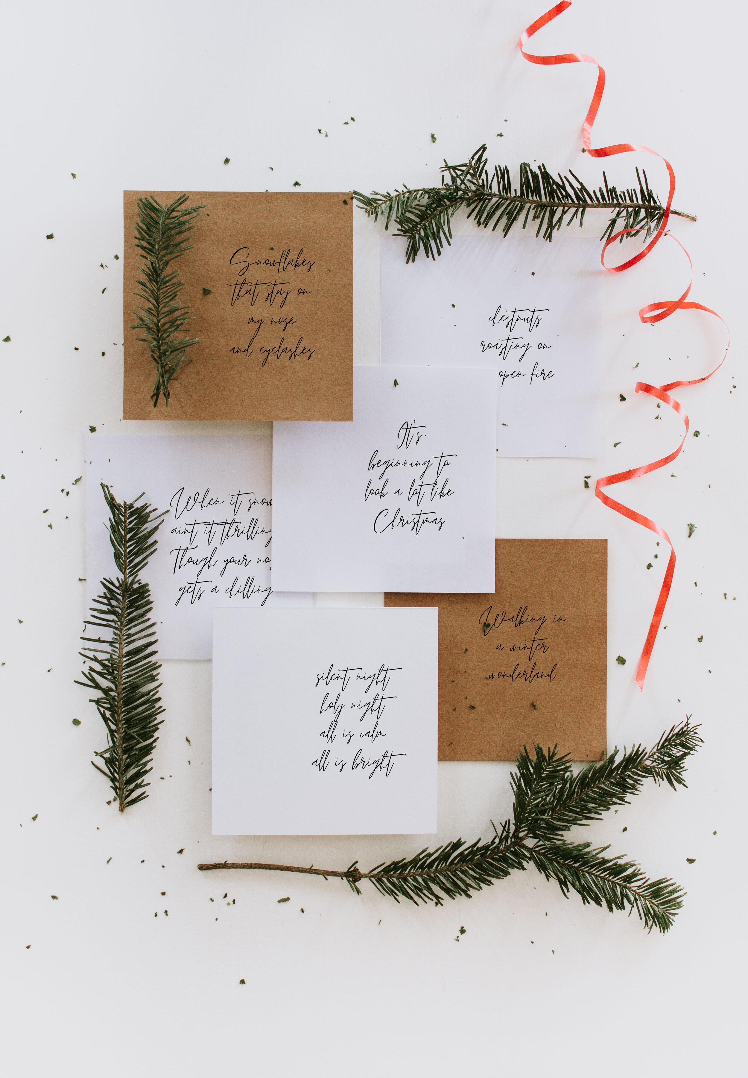 10 Free Christmas Place Cards - Christmas song lyrics made into place setting cards by Nadine Stay. Download and print these holiday prints from home