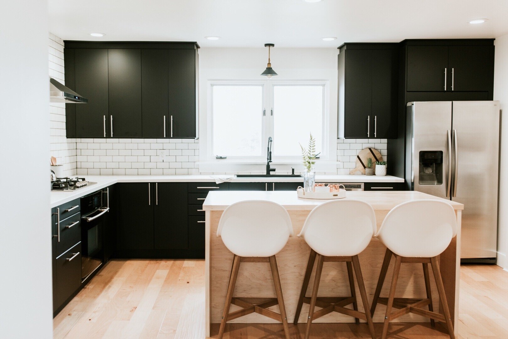 10 home renovation decisions we regret | Nadine Stay | Home remodel mistakes you should avoid. Get a counter depth fridge, install a garbage disposal, put an outlet in the kitchen island, level the floors, and fix your foundation first.