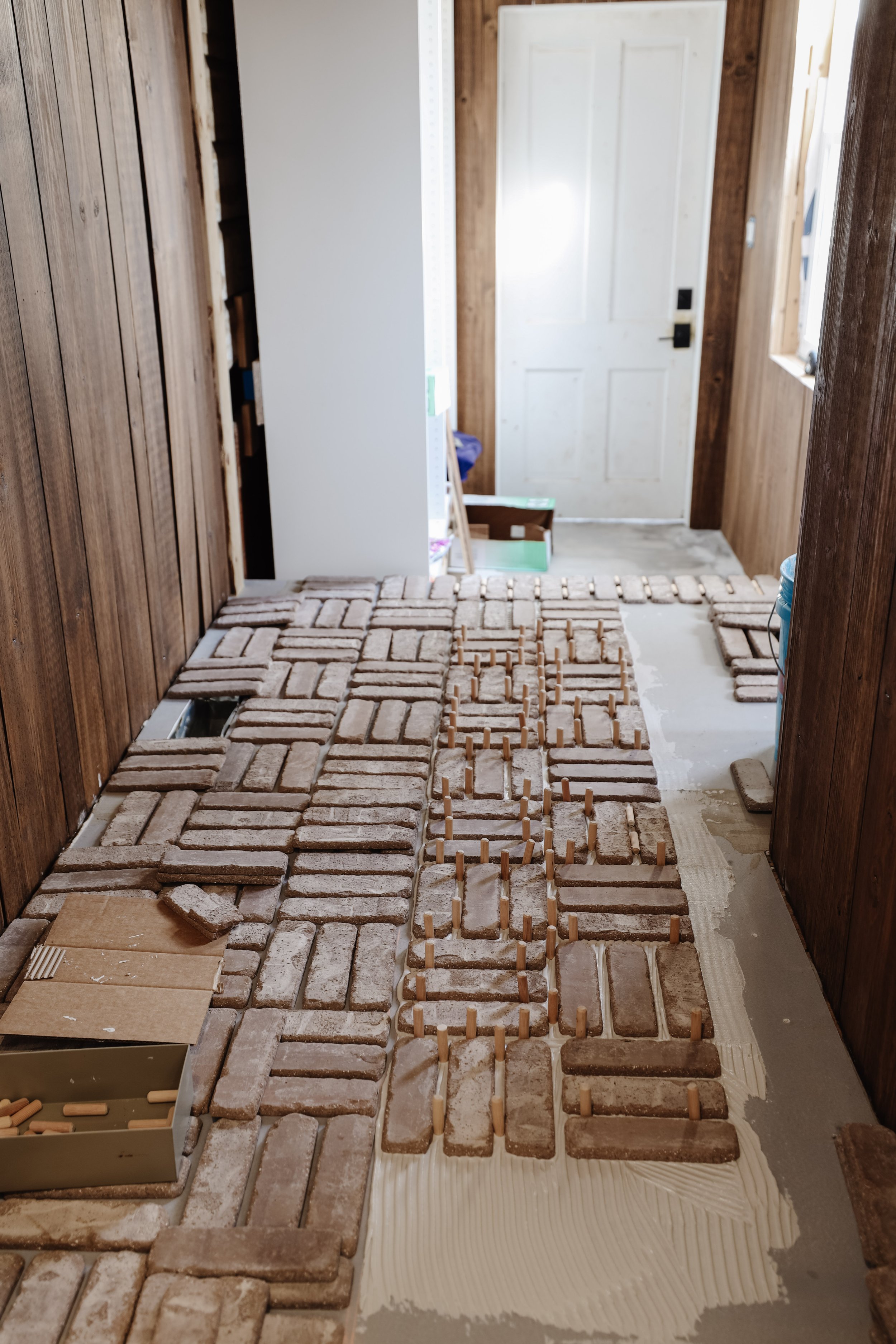 How to install interior thin brick veneer floors. How to install bricks in a basketweave pattern. Laundry room and mudroom brick floor. Tumbled brick flooring. Old world brick floors inside. DIY brick floor installation for beginners. | Nadine Stay