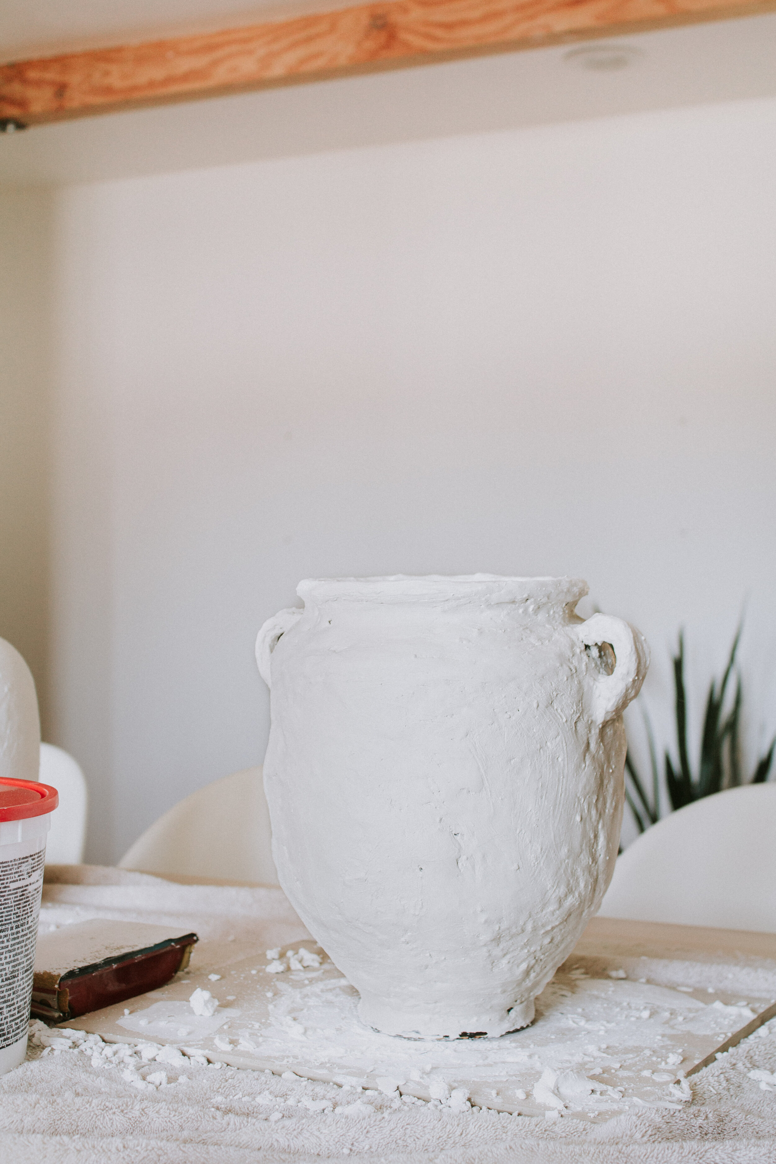 DIY Dark & Dimensional Aged Old World Pottery Makeover - How to make thrifted vases look old and vintage. Thrifted vase makeover with plaster and brown layered paint. Vase Makeover by Nadine Stay.