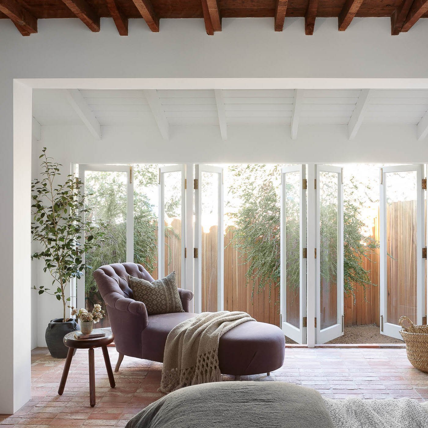 Beam and wood slats ceiling inspiration. Image via Shoppe Amber Interiors