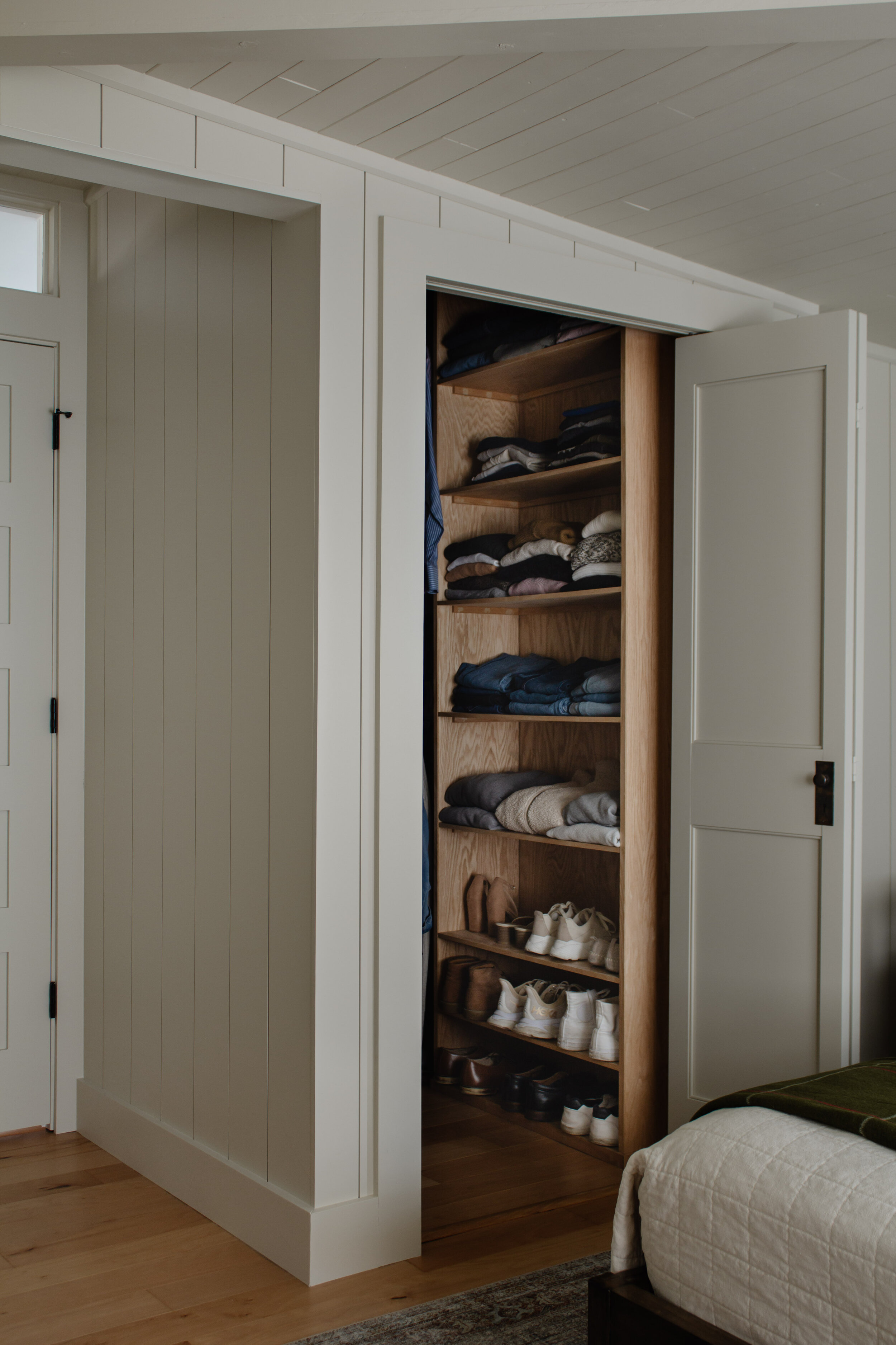 How we customized our standard bifold doors to look like high end double doors for less than $25. How to DIY and customize a single panel door with antique handles and knobs. Bedroom closet door inspiration. | Nadine Stay