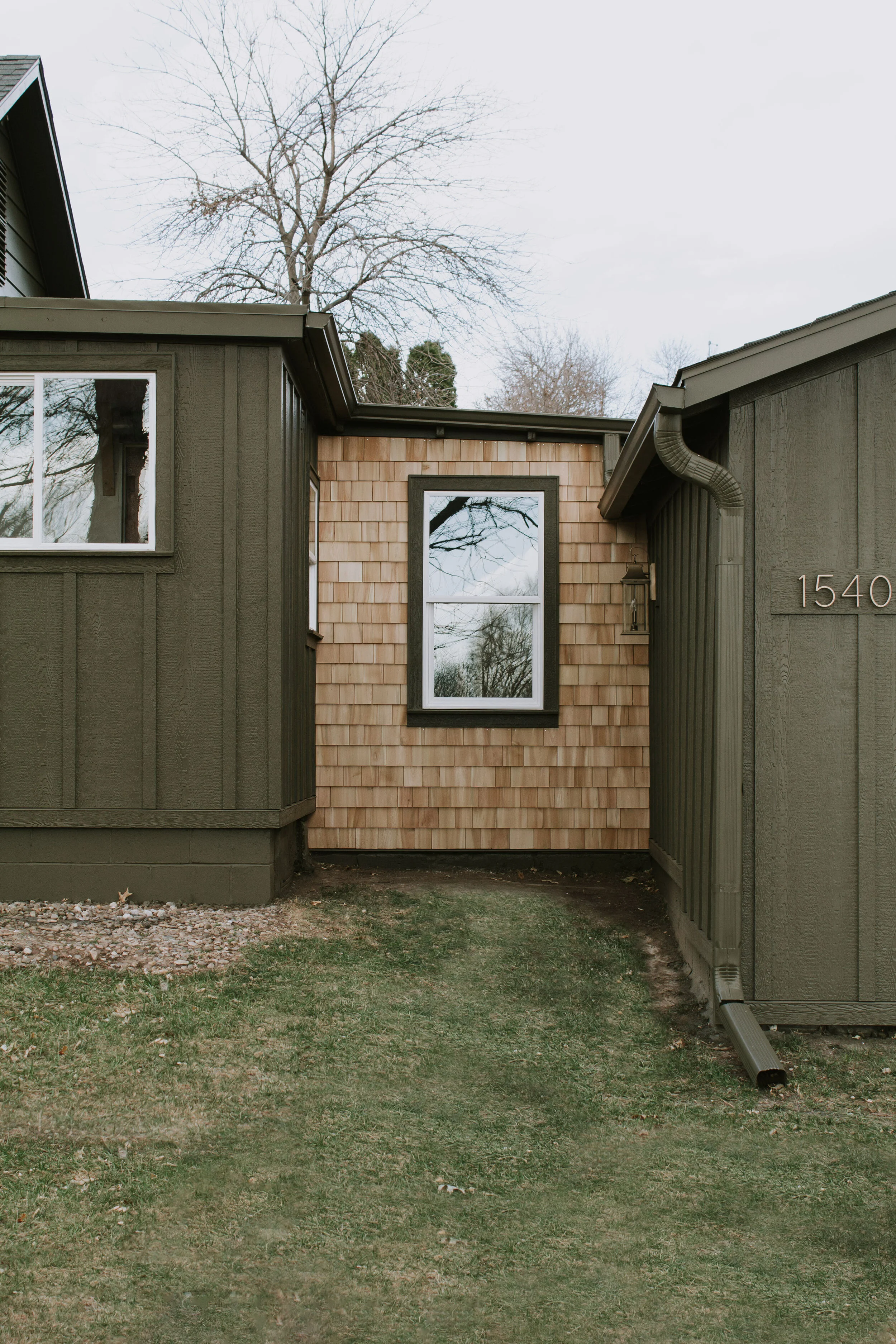 Exterior board and batten and cedar shake shingle renovation. Cabin inspired exterior renovation. Exterior makeover before and after by Nadine Stay