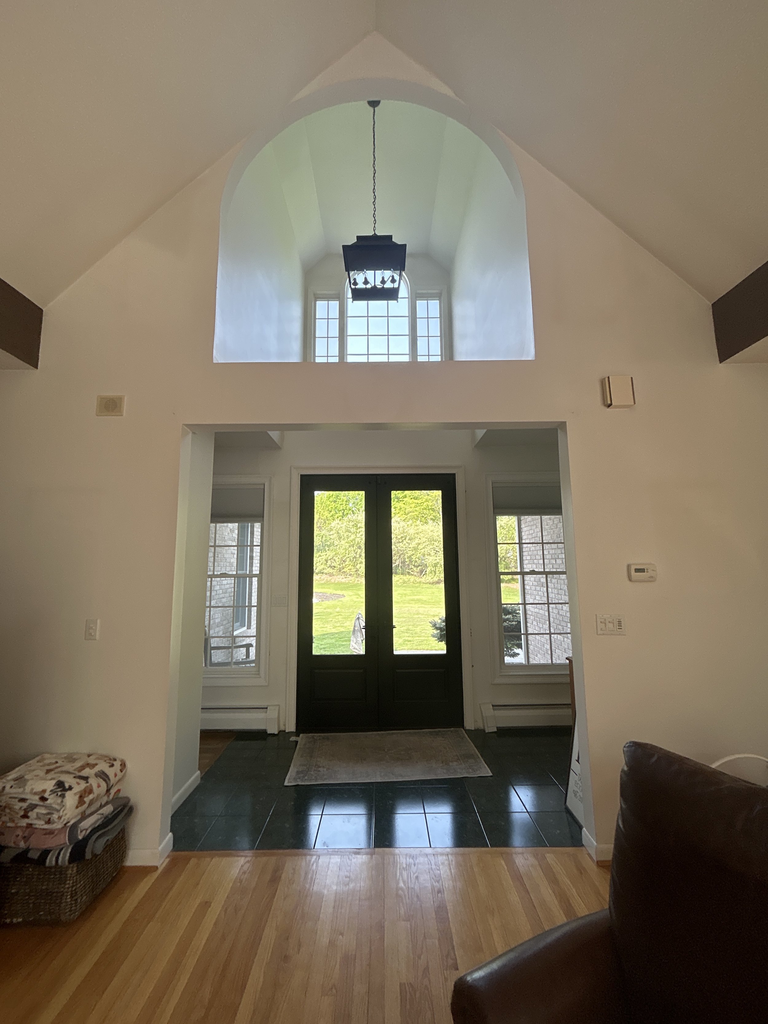 Dear Danica, how to design a foyer. Arched foyer. Ceiling pendant lantern. How to rework entryway.