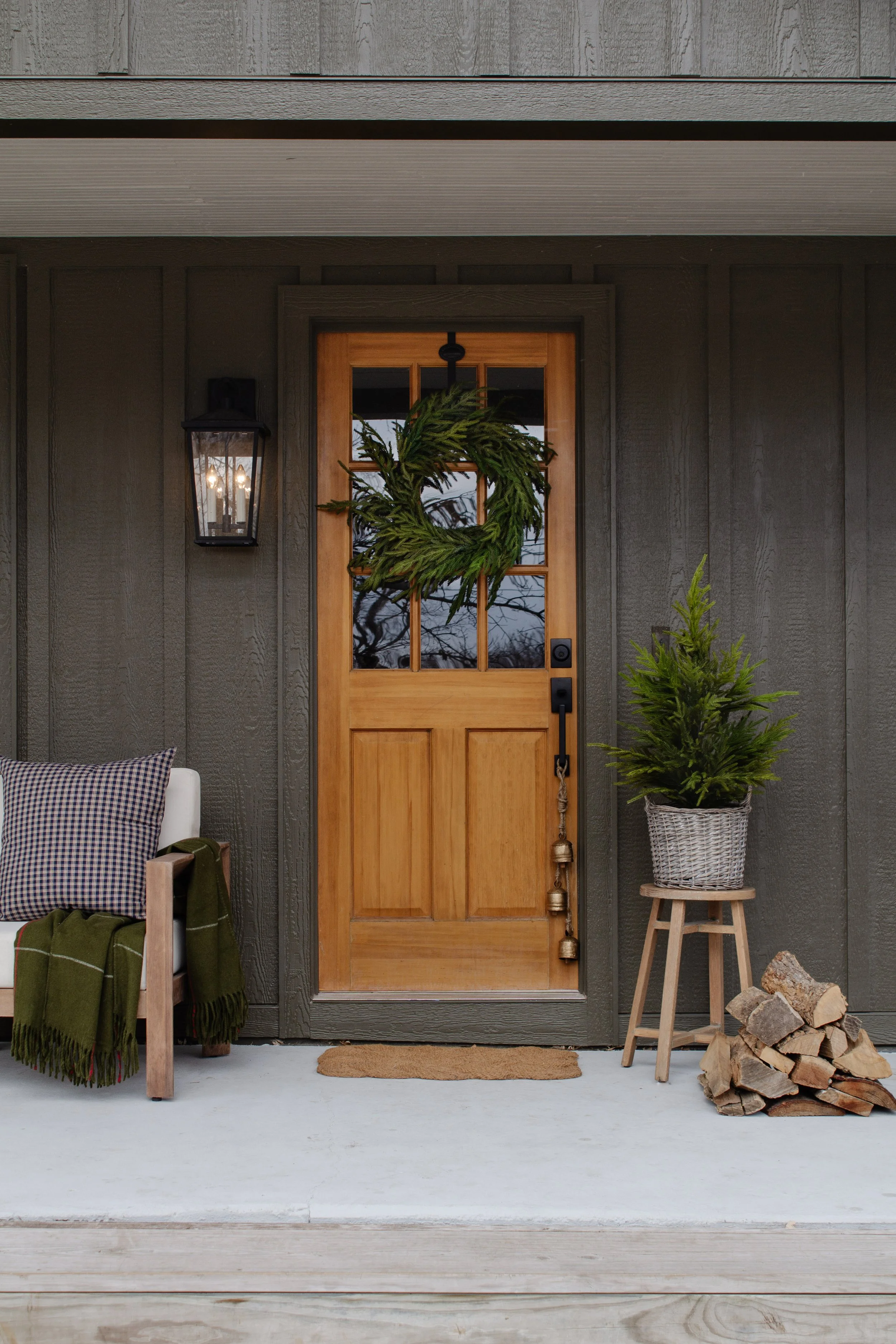 Cozy Christmas living room decor. Holiday mantle decor. Faux garland that looks real. Faux pine branches for Christmas decor. Fireplace decorating ideas for Christmas. Simple Christmas decor by Nadine Stay