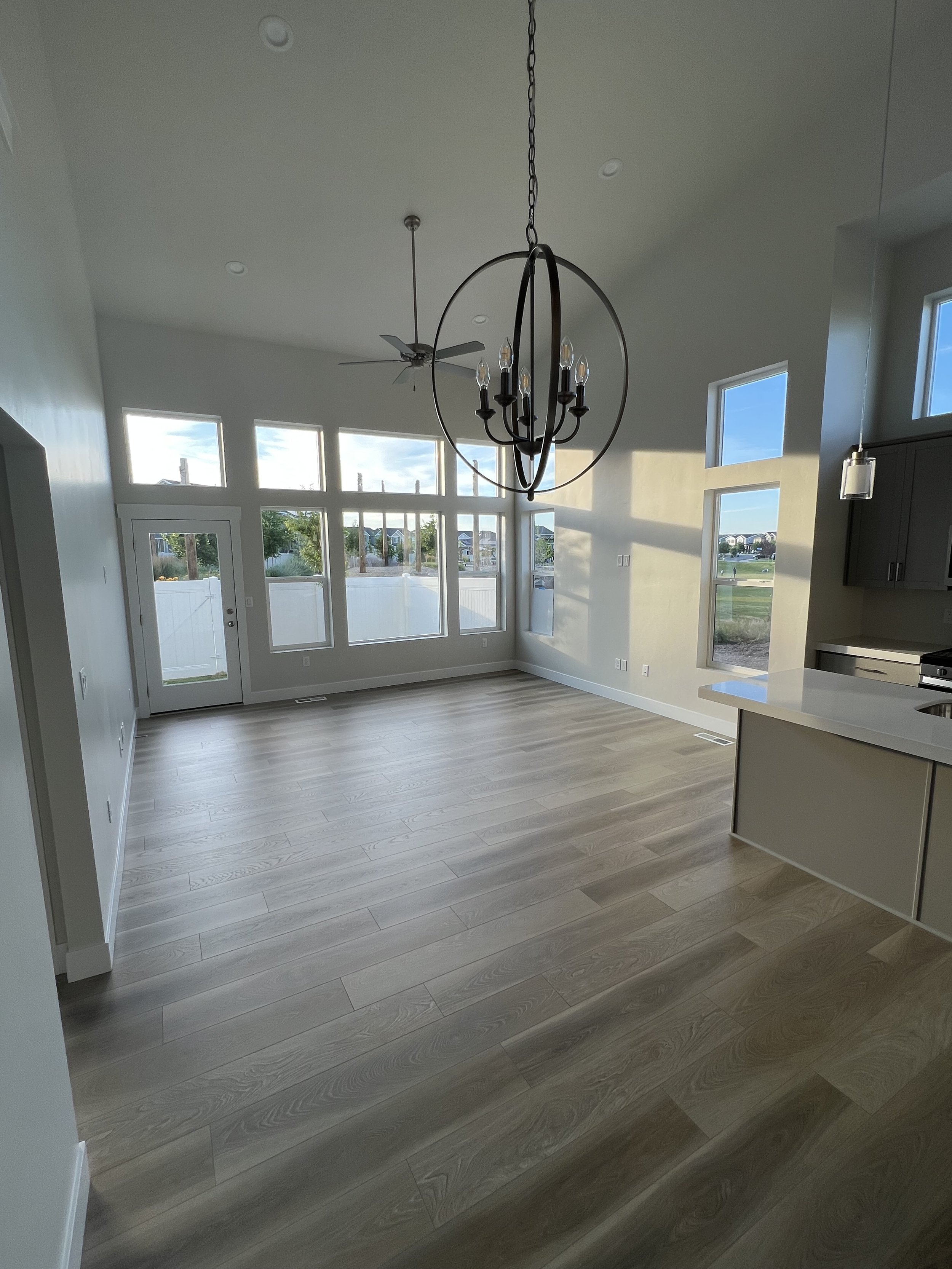 When to use curtains vs shades. How to use curtains with high ceilings. How to use curtains with lots of windows. How high to hang curtains. How to hang curtains with a door. Window treatment tips by Nadine Stay