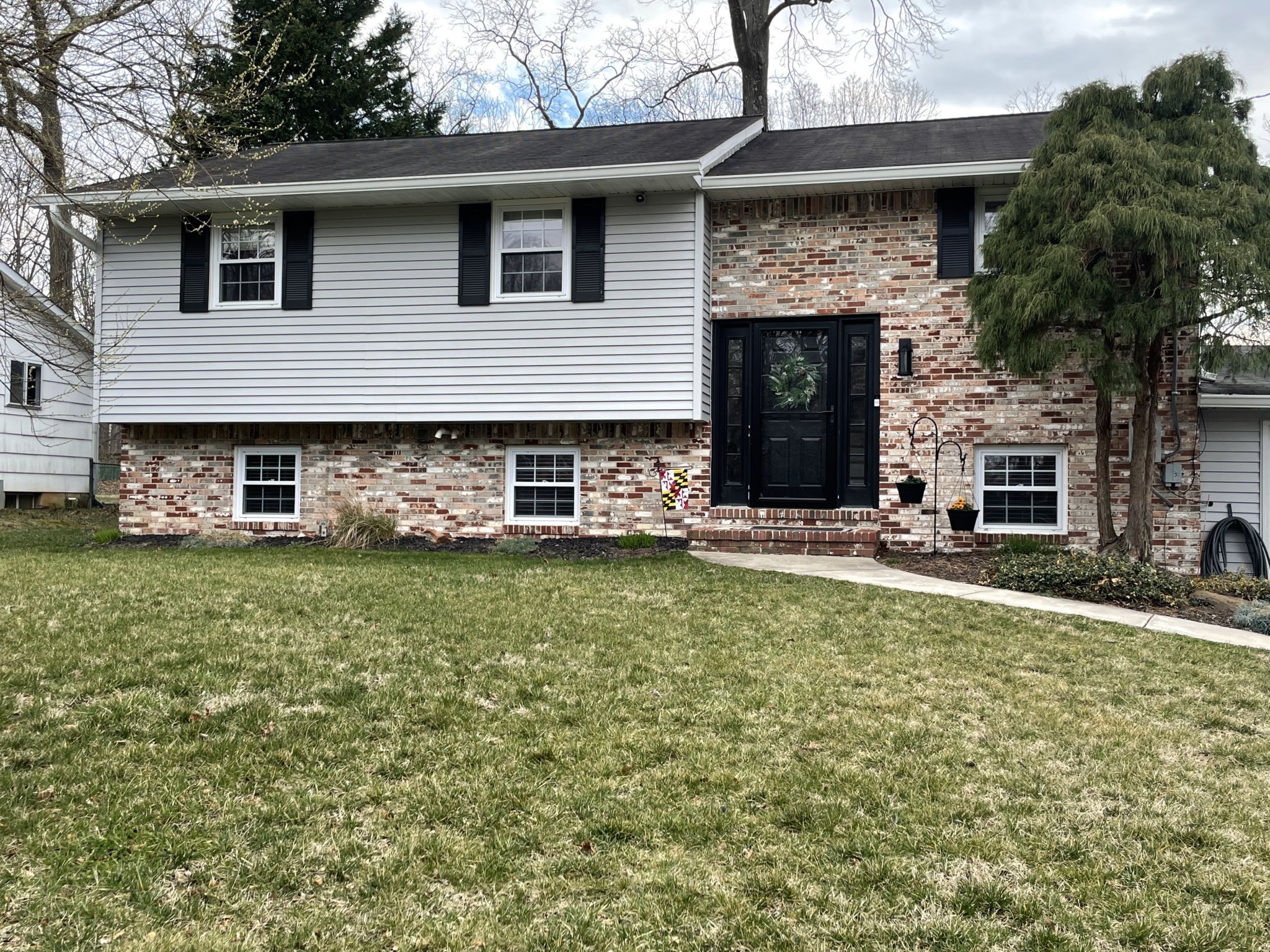 How to add curb appeal and architectural charm to a split level home. 3 ways to update the exterior of a split level home.