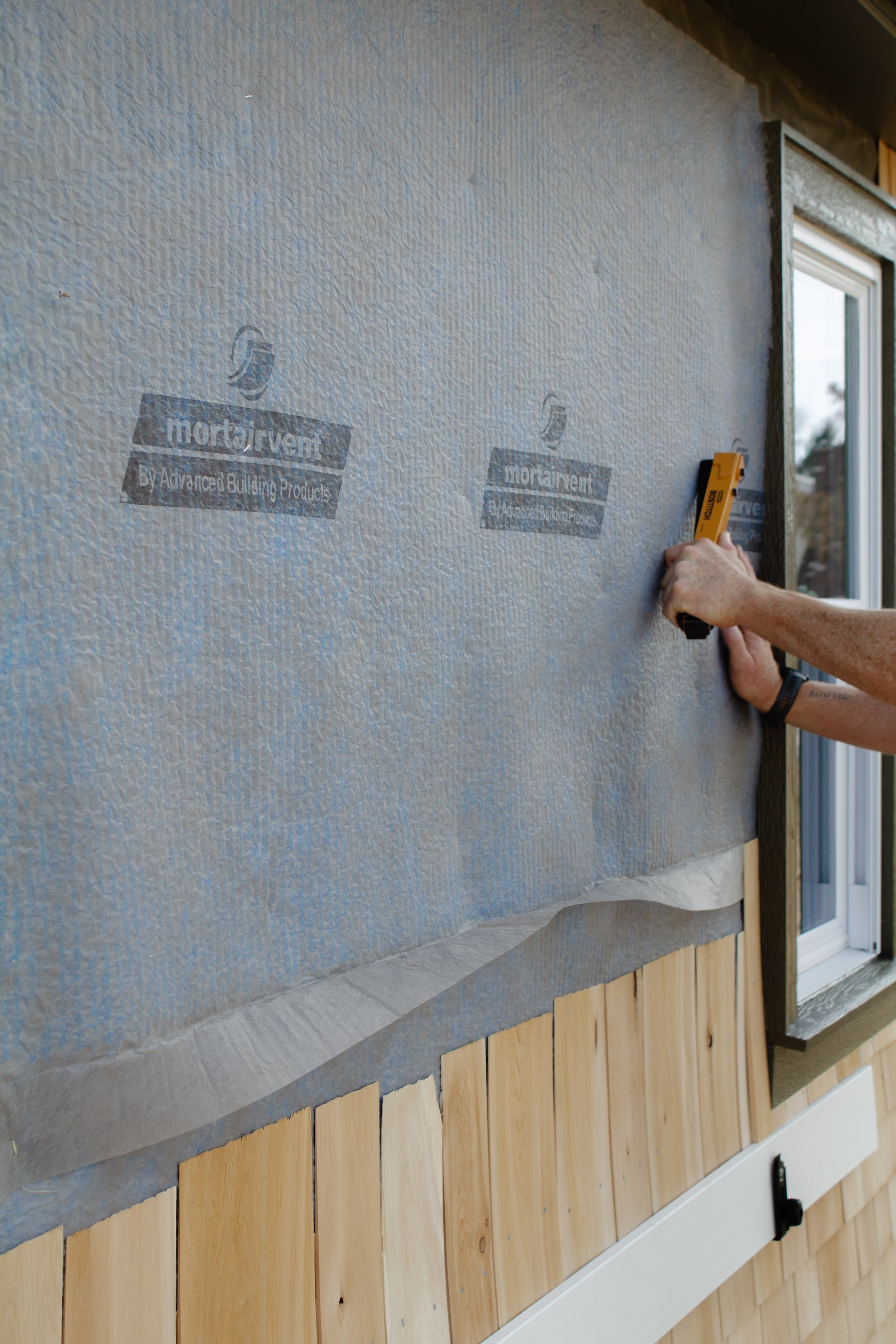 Cedar shingle install progress report. How to install cedar shingles for siding. Where to buy cedar shakes & shingles. Exterior siding project how to. Natural kiln dried cedar siding. | Nadine Stay