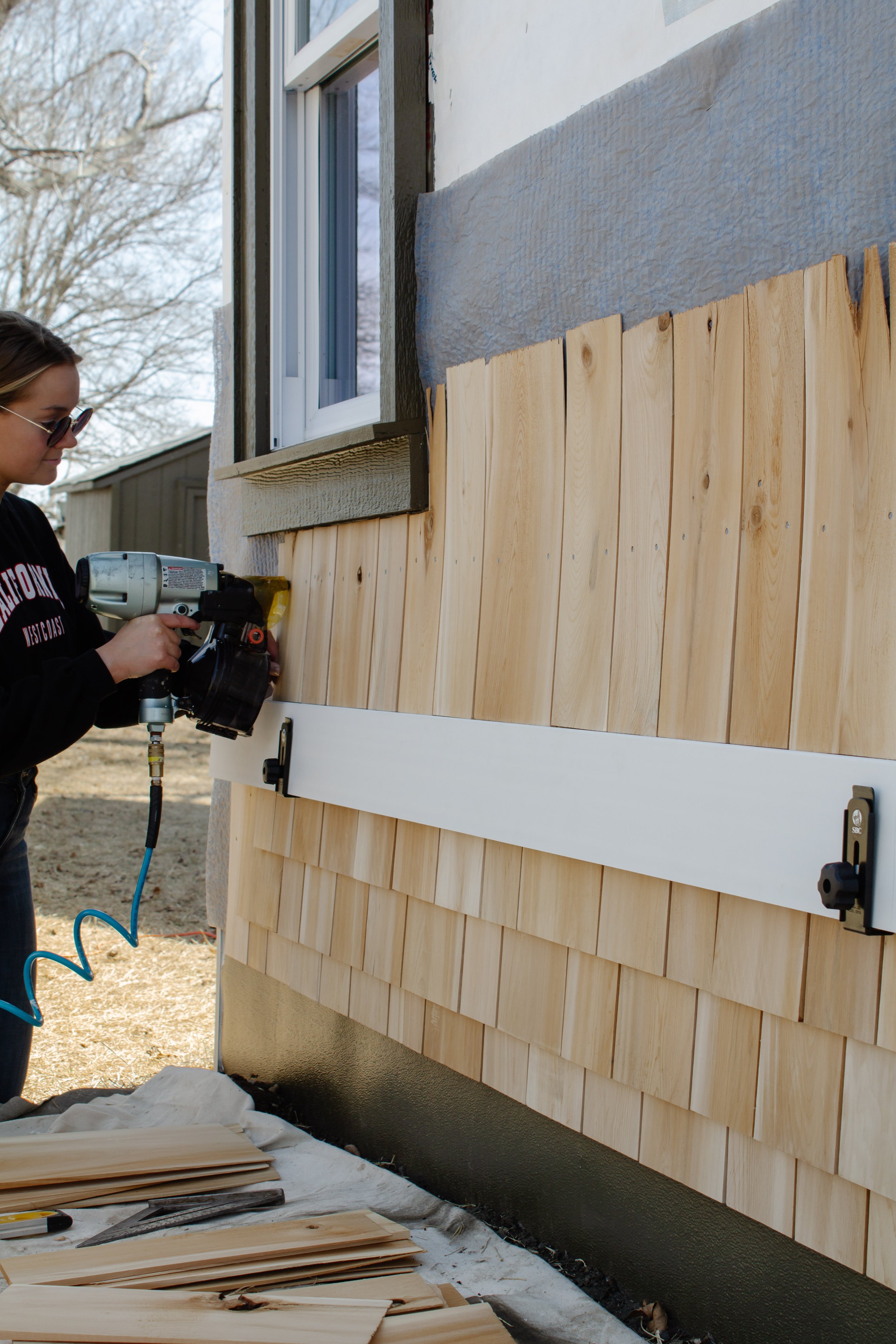 Cedar shingle install progress report. How to install cedar shingles for siding. Where to buy cedar shakes & shingles. Exterior siding project how to. Natural kiln dried cedar siding. | Nadine Stay