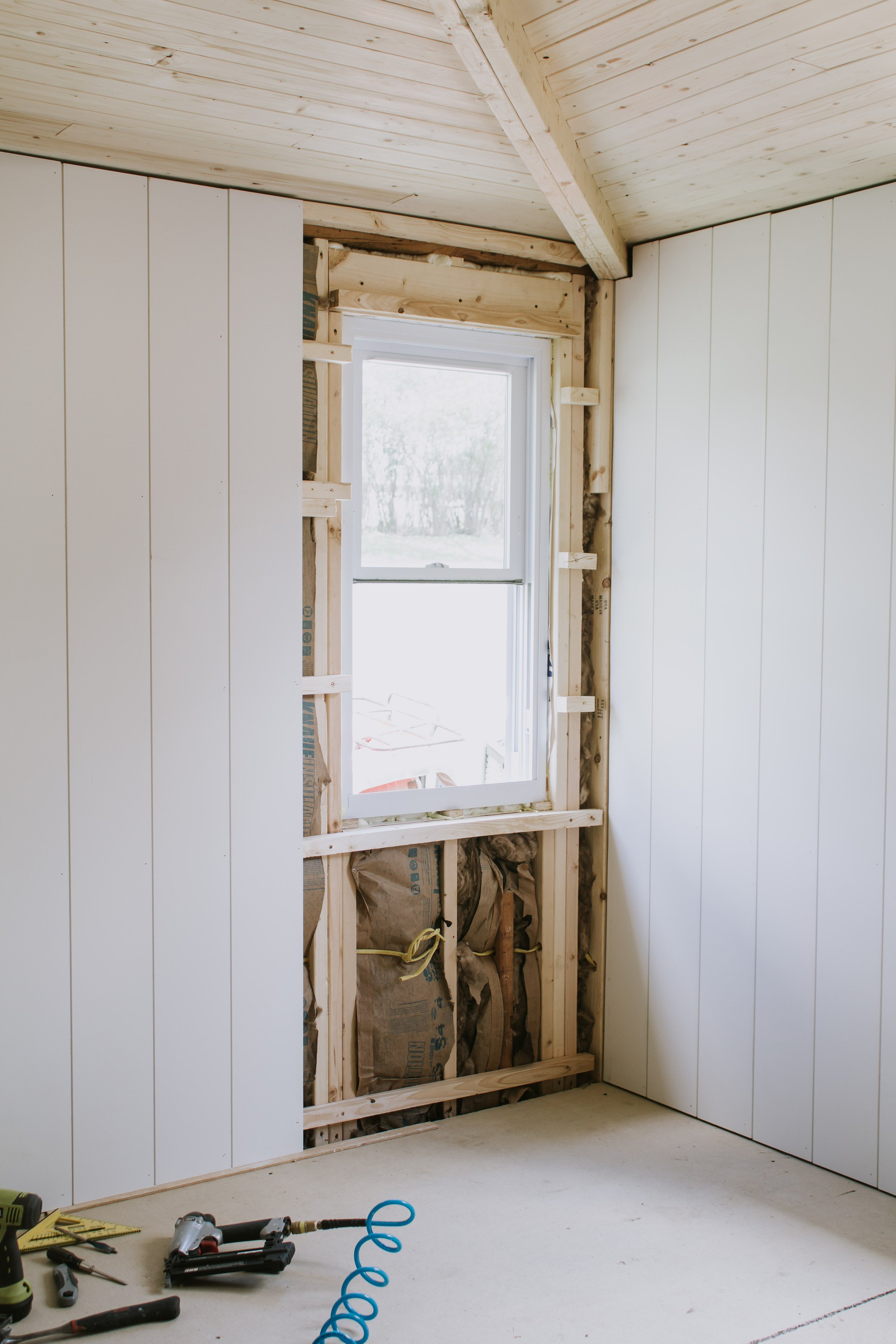 How we installed vertical planks on our walls. Defining the difference between shiplap vs tongue and groove vs nickel gap? How to add vertical shiplap. Where to buy vertical planks. California casual cabin bedroom renovation. | Nadine Stay