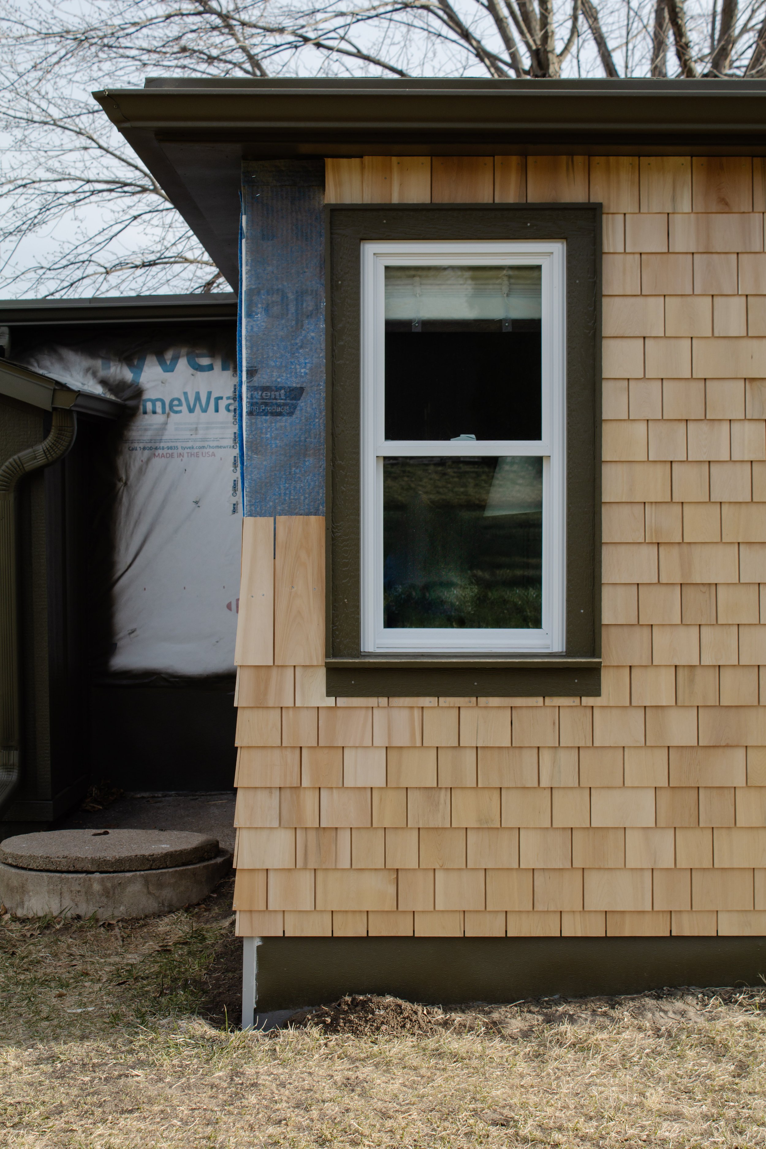 Cedar shingle install progress report. How to install cedar shingles for siding. Where to buy cedar shakes & shingles. Exterior siding project how to. Natural kiln dried cedar siding. | Nadine Stay