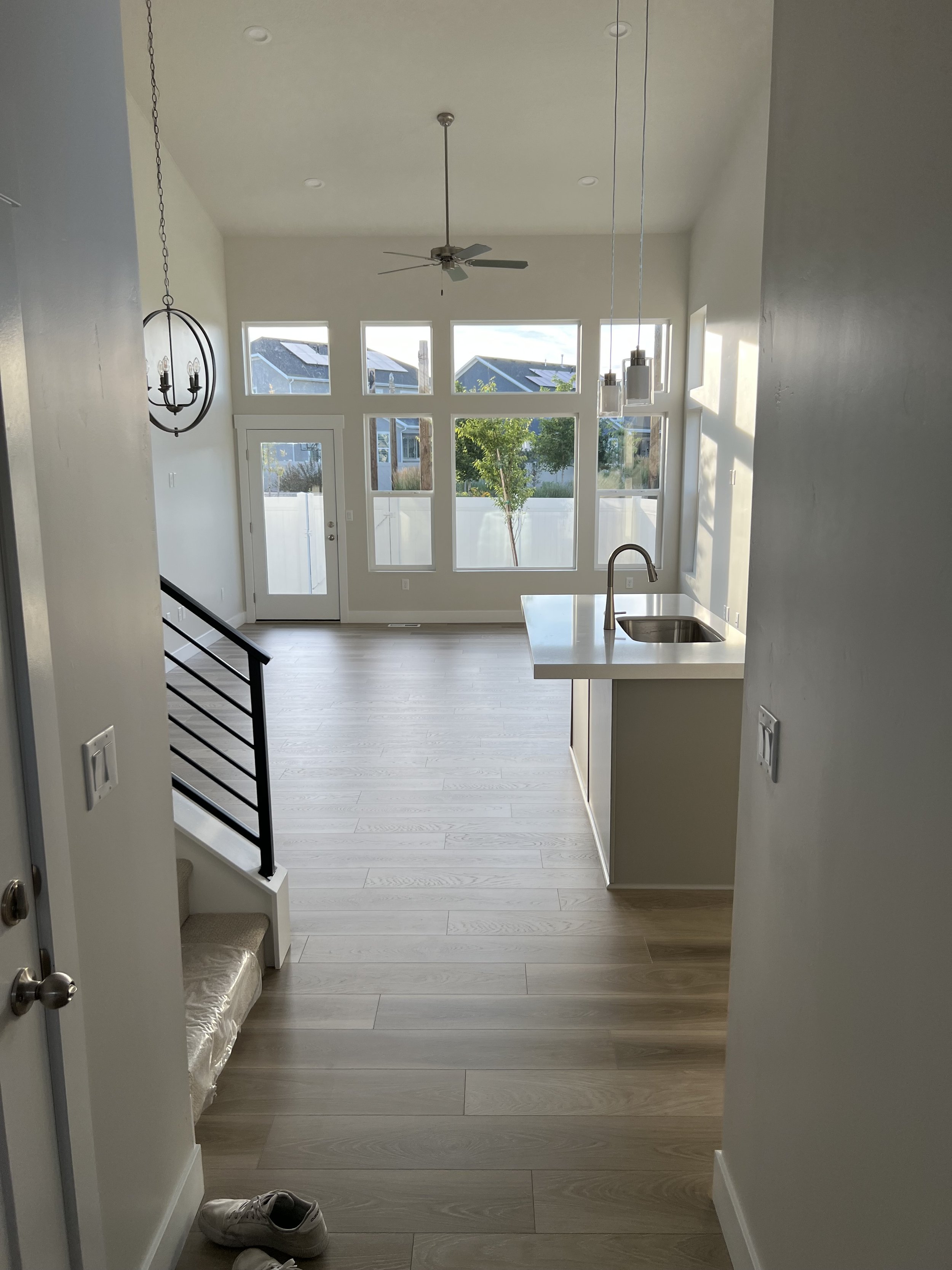 When to use curtains vs shades. How to use curtains with high ceilings. How to use curtains with lots of windows. How high to hang curtains. How to hang curtains with a door. Window treatment tips by Nadine Stay