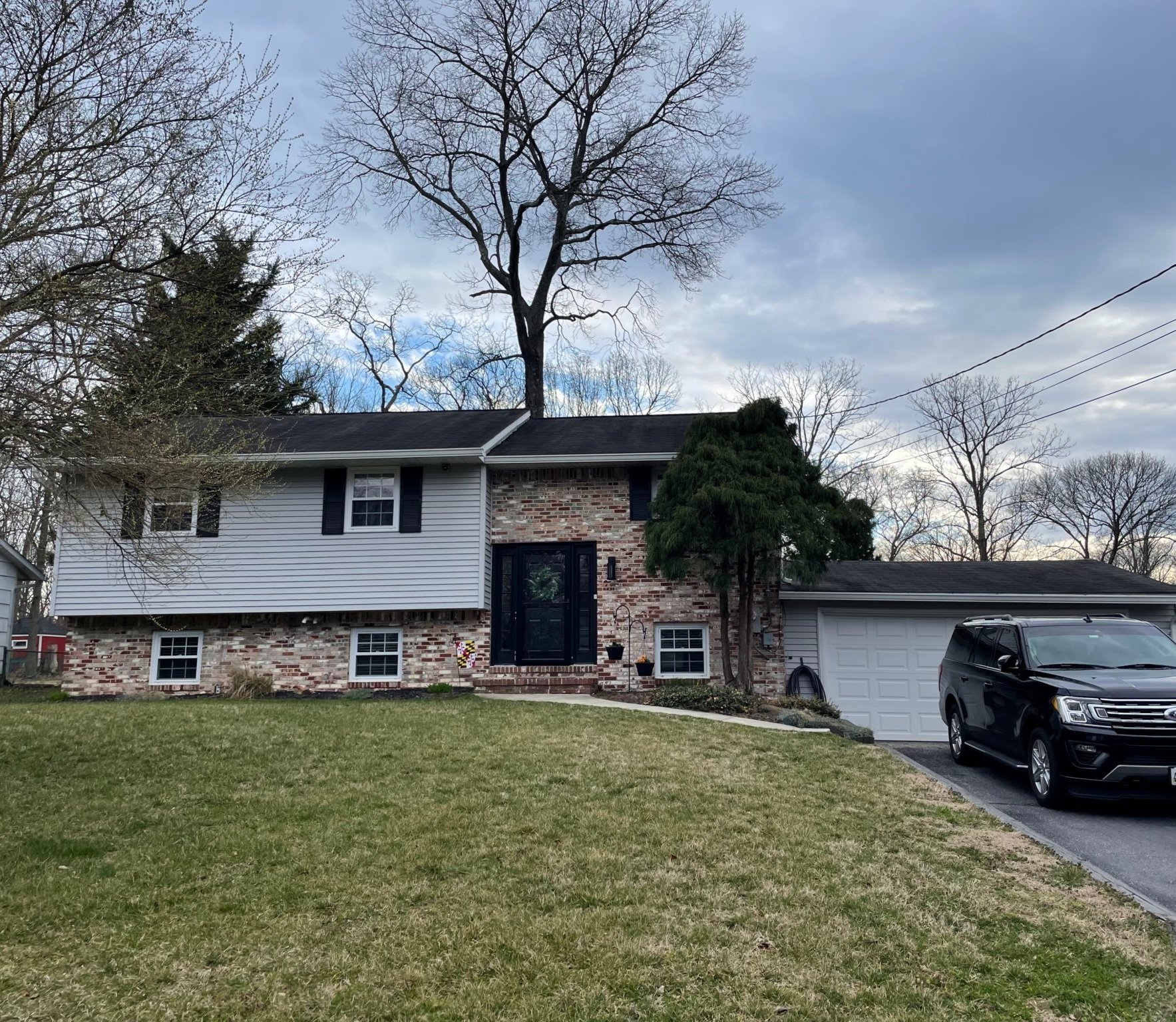 How to add curb appeal and architectural charm to a split level home. 3 ways to update the exterior of a split level home.