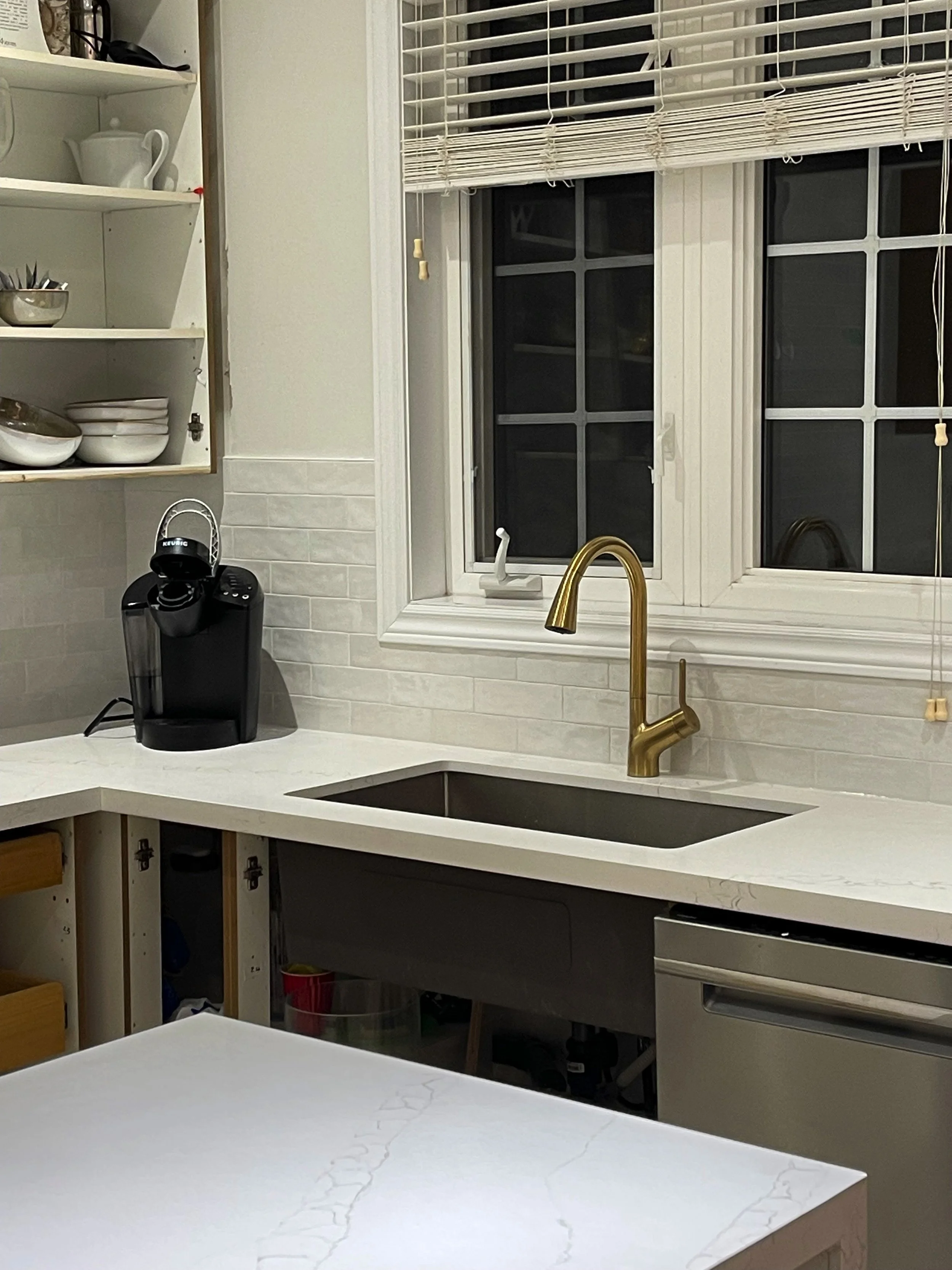 How can I add dimension and warmth to my kitchen with white cabinets. How to add contrast and character to a white kitchen. Interior design tips by Nadine Stay