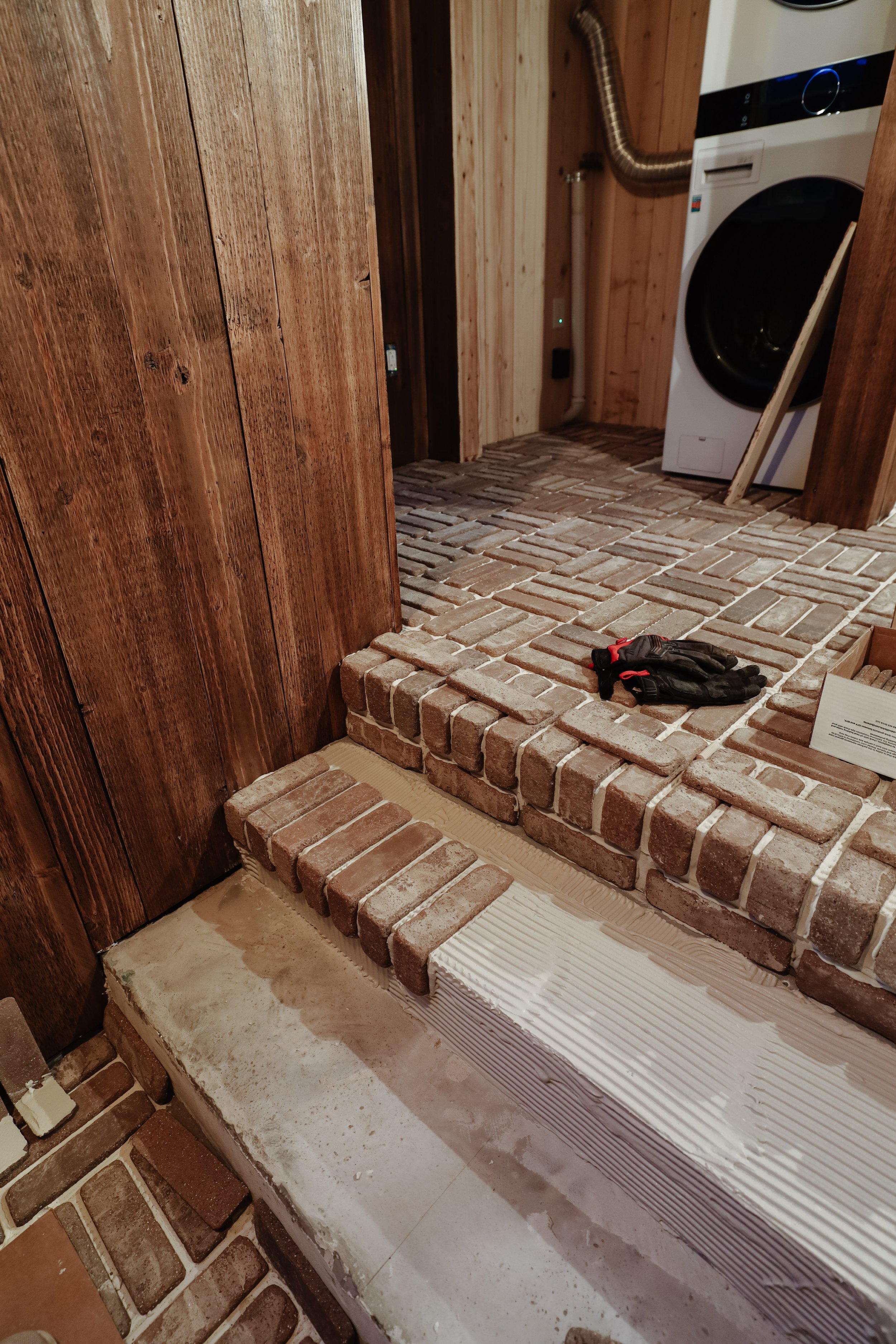 How to install interior thin brick veneer floors. How to install bricks in a basketweave pattern. Laundry room and mudroom brick floor. Tumbled brick flooring. Old world brick floors inside. DIY brick floor installation for beginners. | Nadine Stay