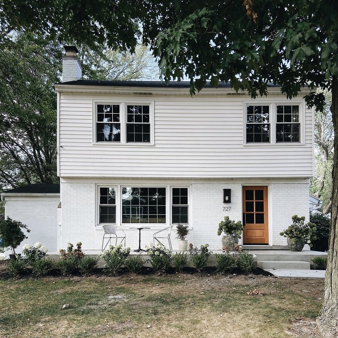 How to add curb appeal and architectural charm to a split level home. 3 ways to update the exterior of a split level home. Image via Brick & Batten