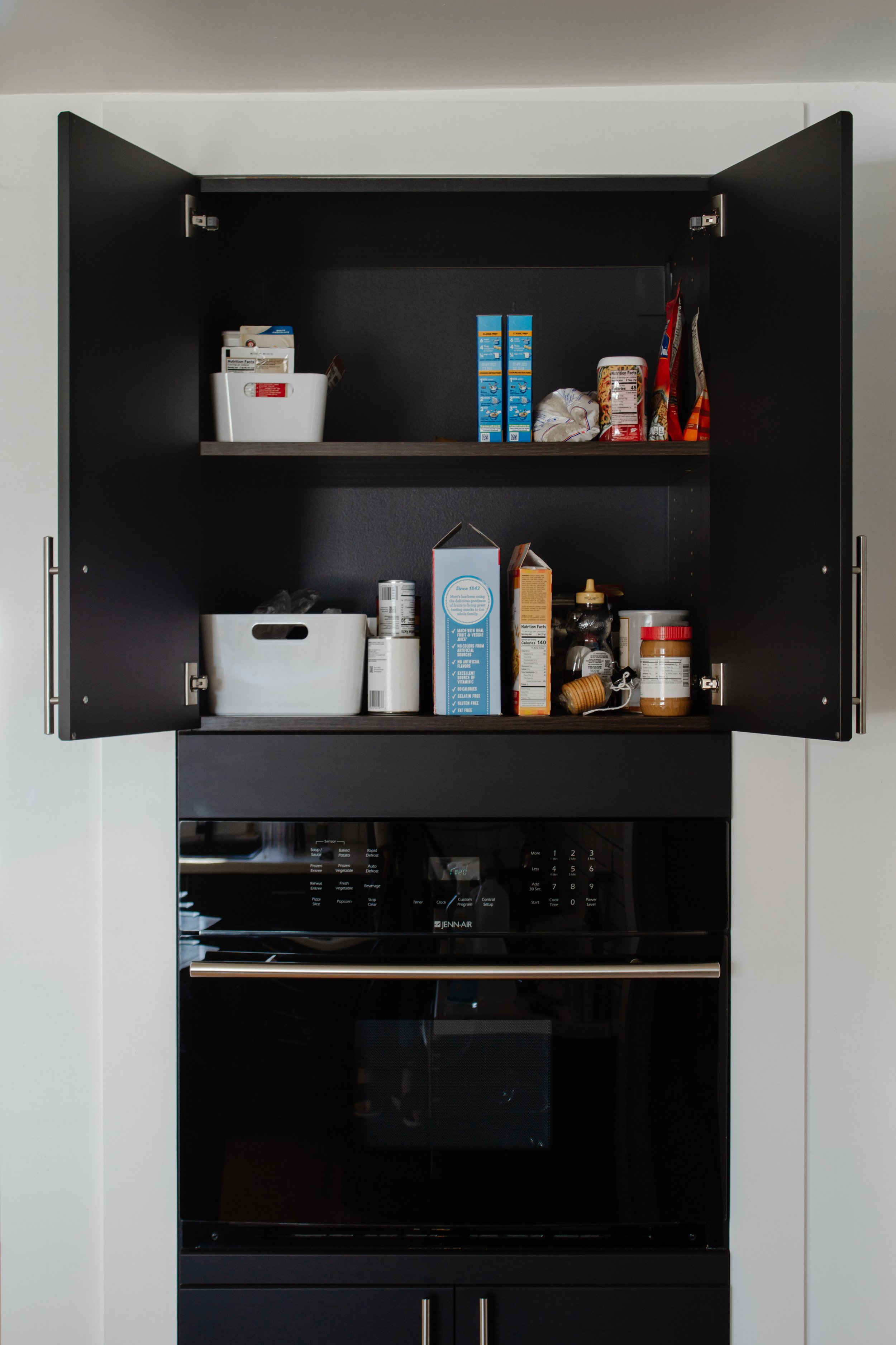 BEFORE | How I organized my kitchen cabinets. Organizational Starter Kit - All the totes, baskets, and storage containers you need to get your house, basement, closets, shelves, and pantry in order. Organization tips by Nadine Stay