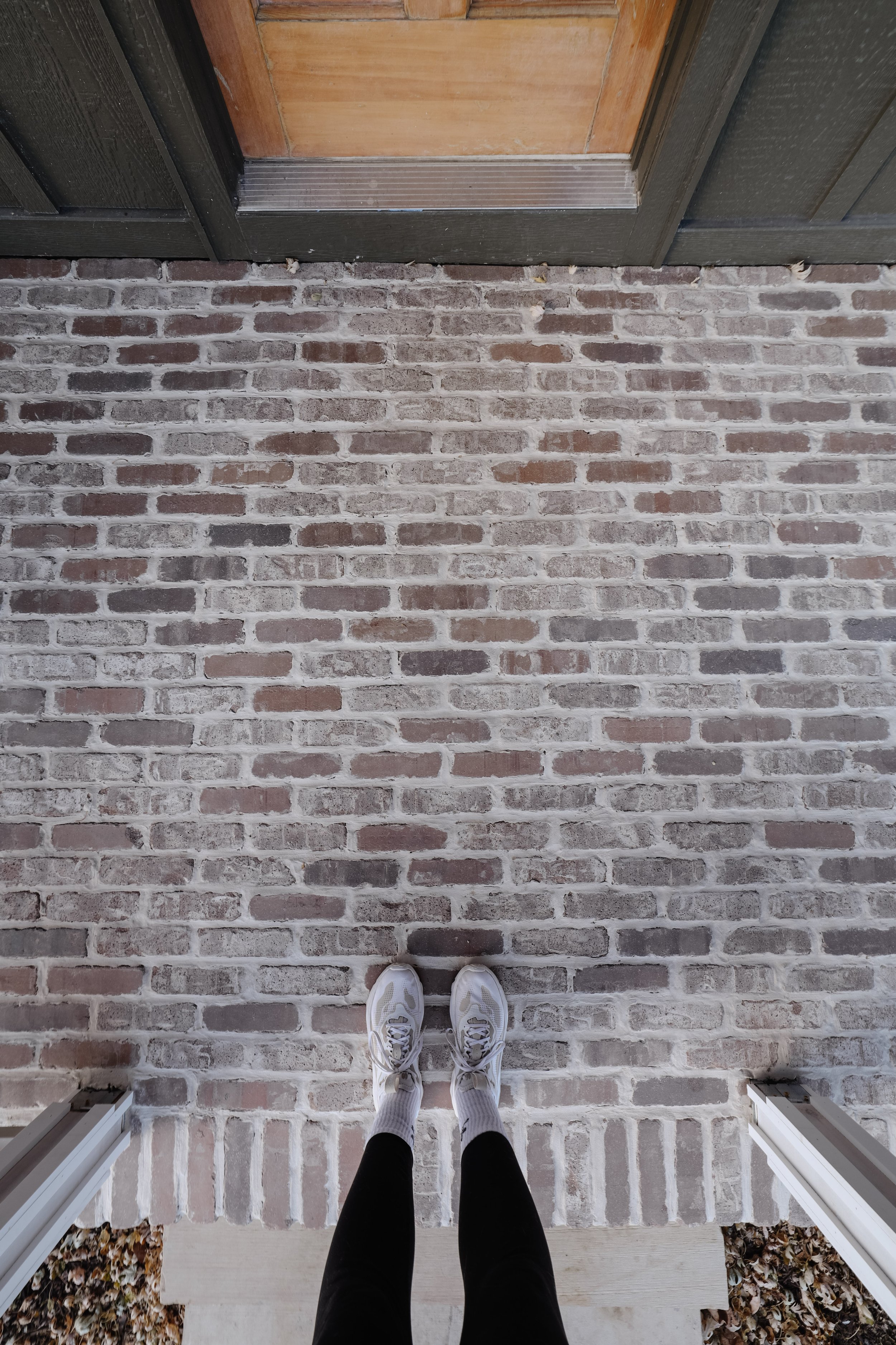 How to add bricks to a concrete porch floor. DIY brick porch installation. Old world, tumbled bricks. Brick porch makeover. Beginner friendly porch makeover. Thin bricks from Old Mill Brick. How to cover a concrete porch floor. | Nadine Stay