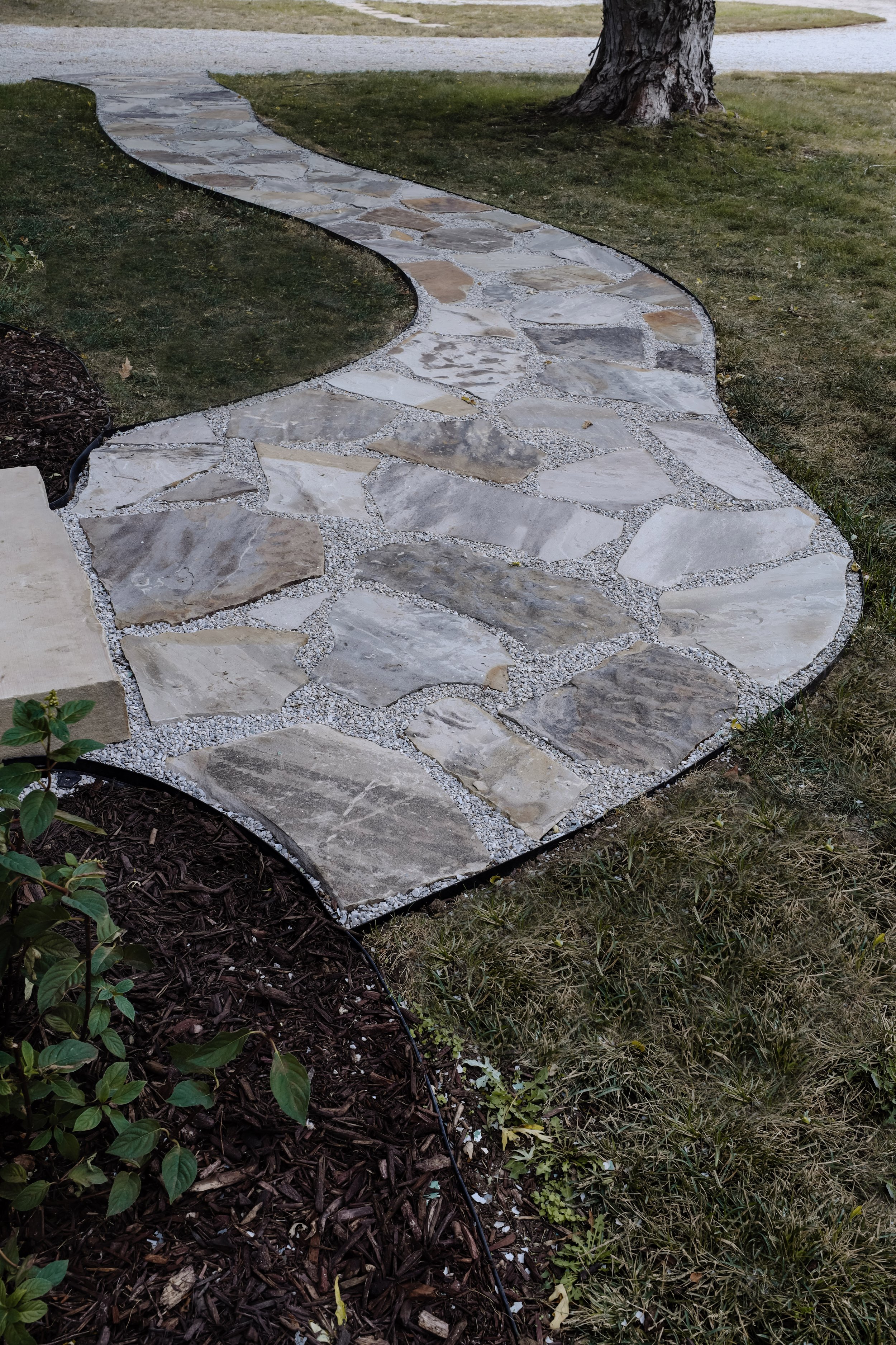 How much do flagstone paths cost? A budget breakdown of our flagstone path. Foxglove flagstone and limestone chip path cost. How much do stone steps cost? | Nadine Stay