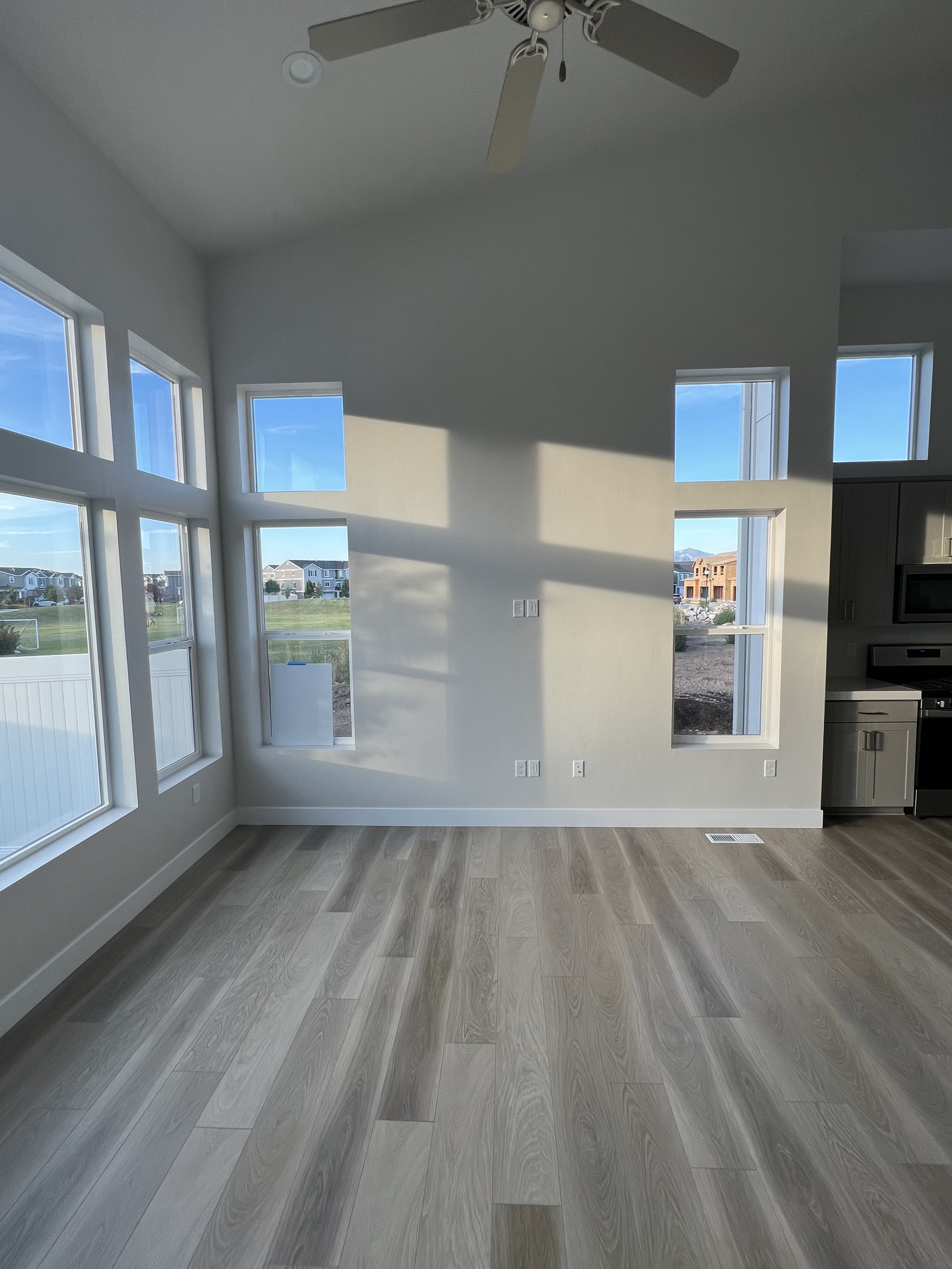 When to use curtains vs shades. How to use curtains with high ceilings. How to use curtains with lots of windows. How high to hang curtains. How to hang curtains with a door. Window treatment tips by Nadine Stay