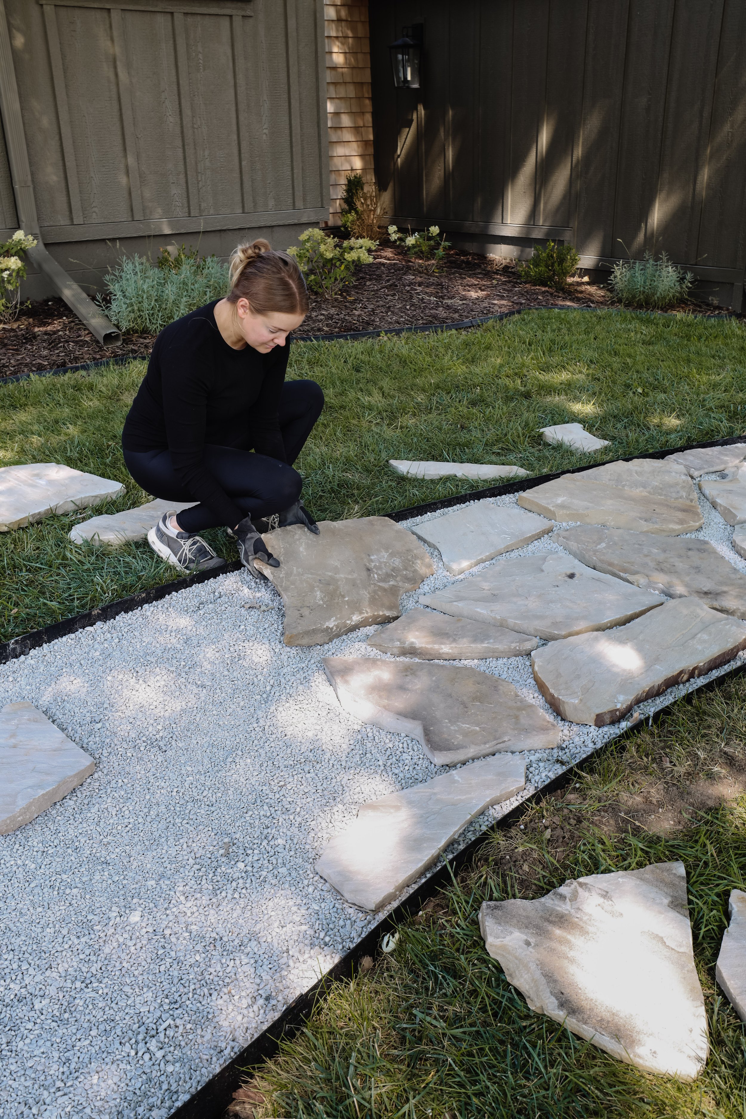 Our flagstone path to our front porch. How to install a flagstone path to your house. How to glue pea gravel path so it doesn't scatter. Organic shaped flagstone path with limestone chips. Blue and orange flagstones. | Nadine Stay