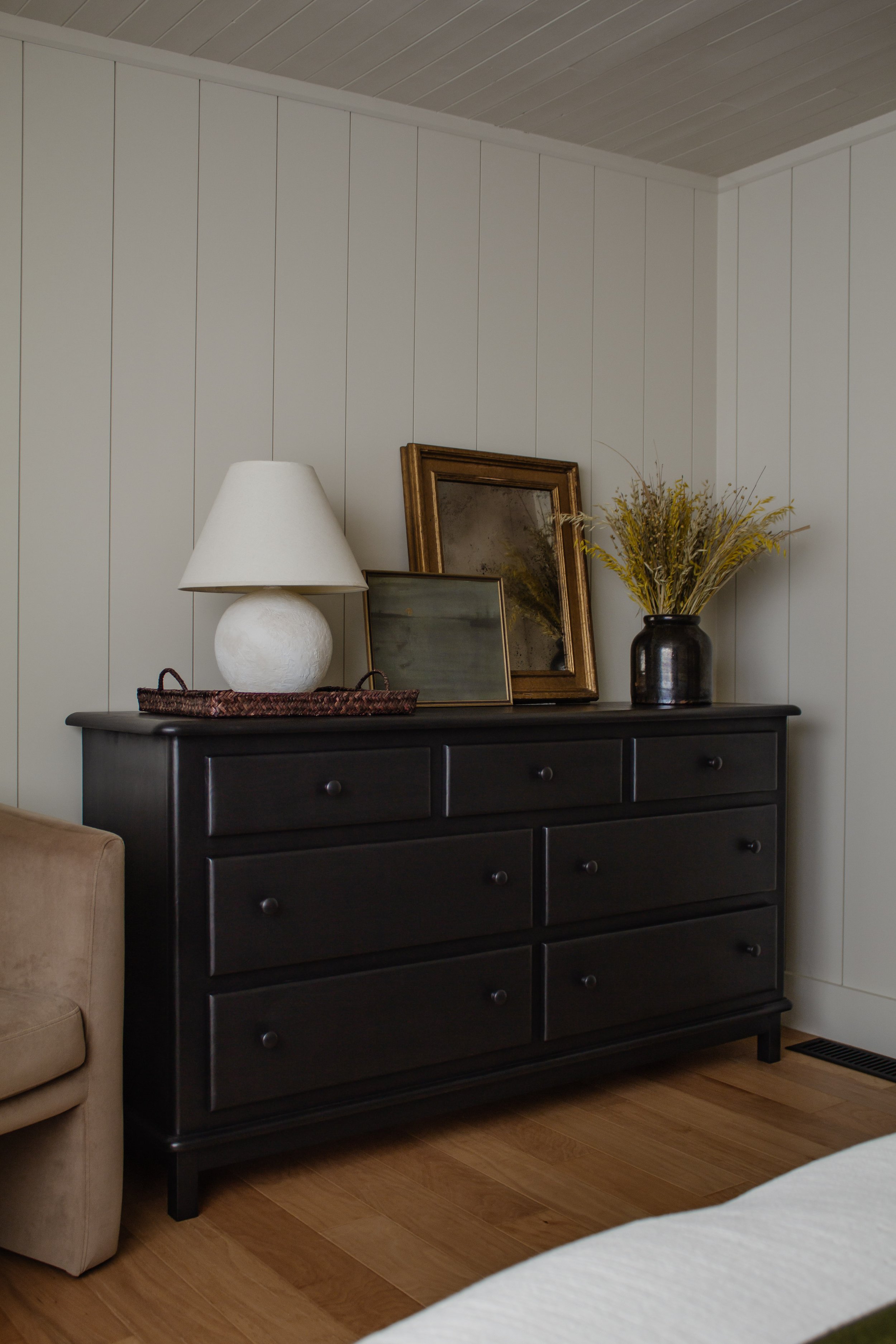 Primary bedroom remodel and makeover. How we turned our tiny bedroom with low ceilings into a cabin oasis. Wood plank ceiling. Vertical shiplap, vertical plank walls. Cabin bedroom. California casual bedroom. Black wood dresser makeover. Nadine Stay