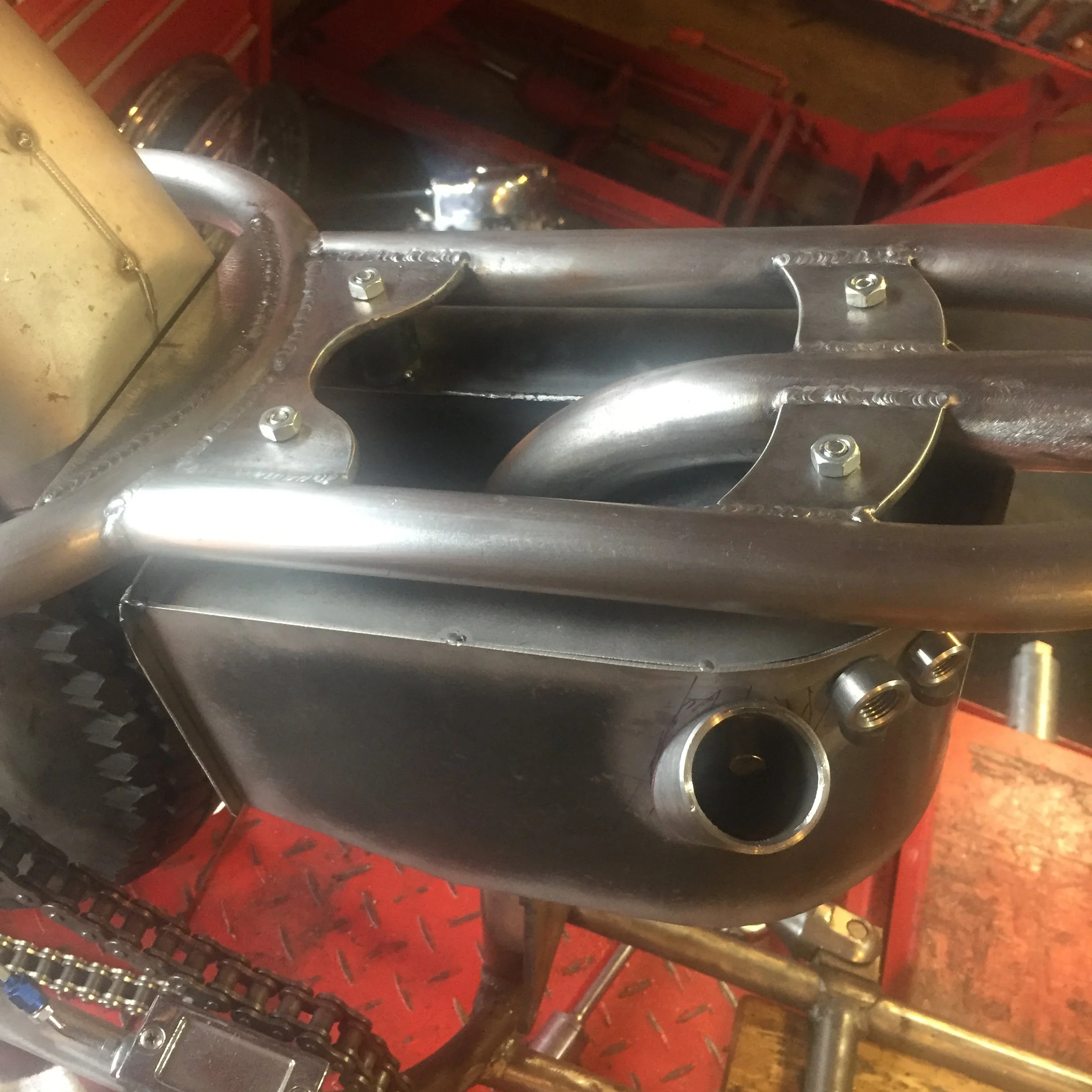  Side view of the oil tank mocked up.  There are still a couple of spots that need to be trimmed before it is welded up, but the main thing is that it fits the lines of the bike. 