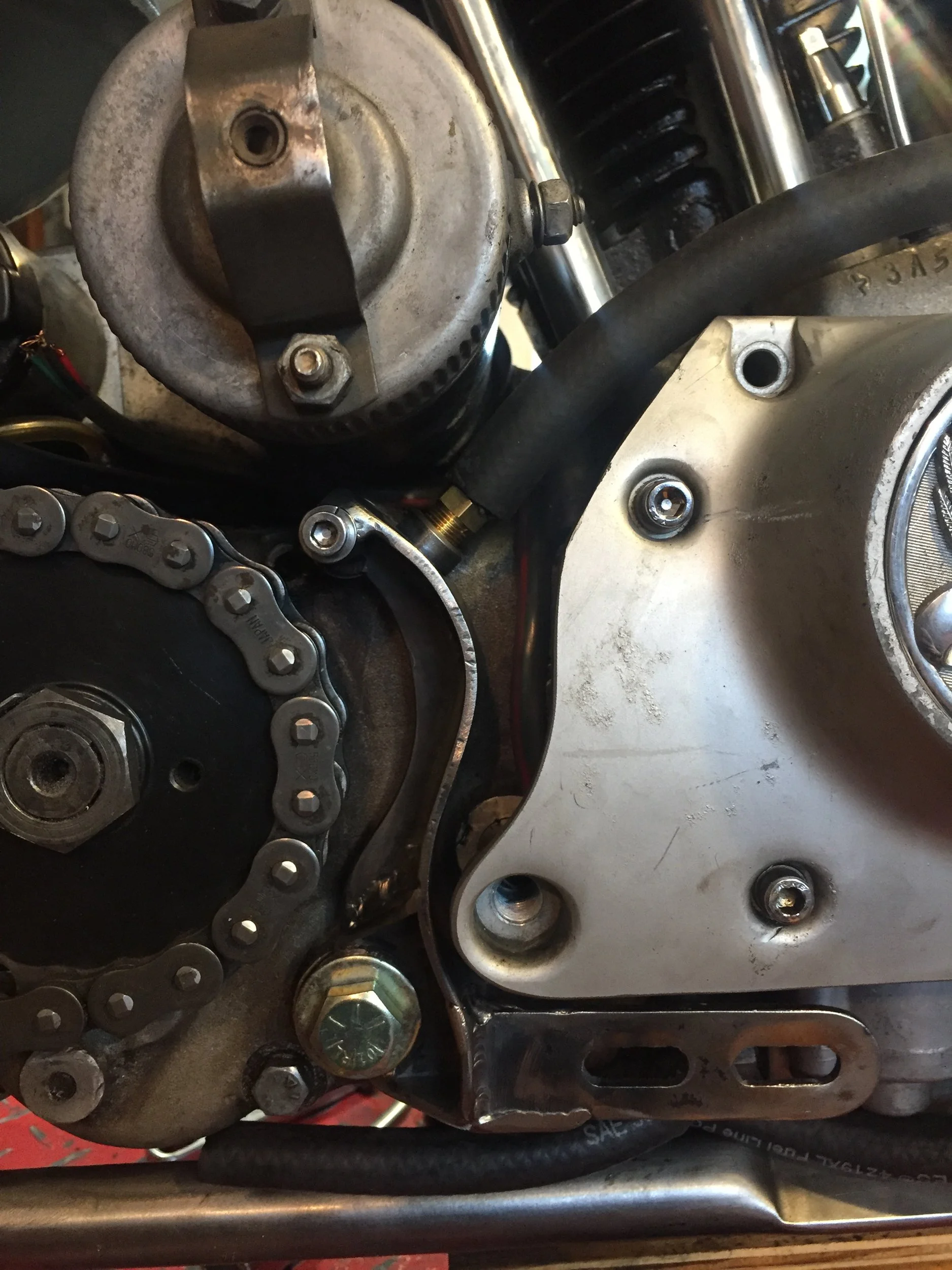  Here is what the chain guard/chain oiler/exhaust mount from the previous photo looks like installed.  An important detail that will all but disappear once the exhaust is mounted. 