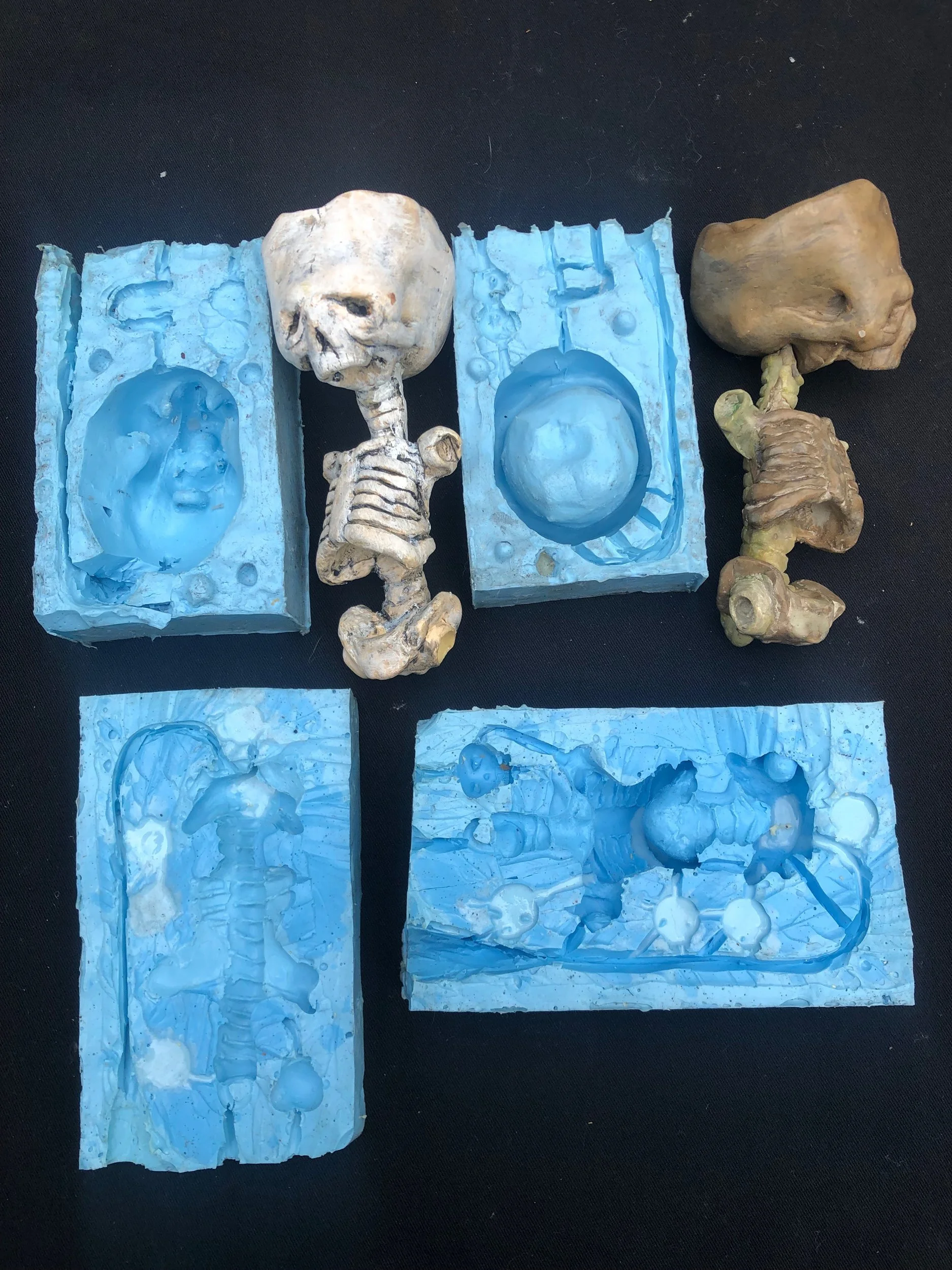  Pair of two part silicone molds for two part resin cast from clay master. 