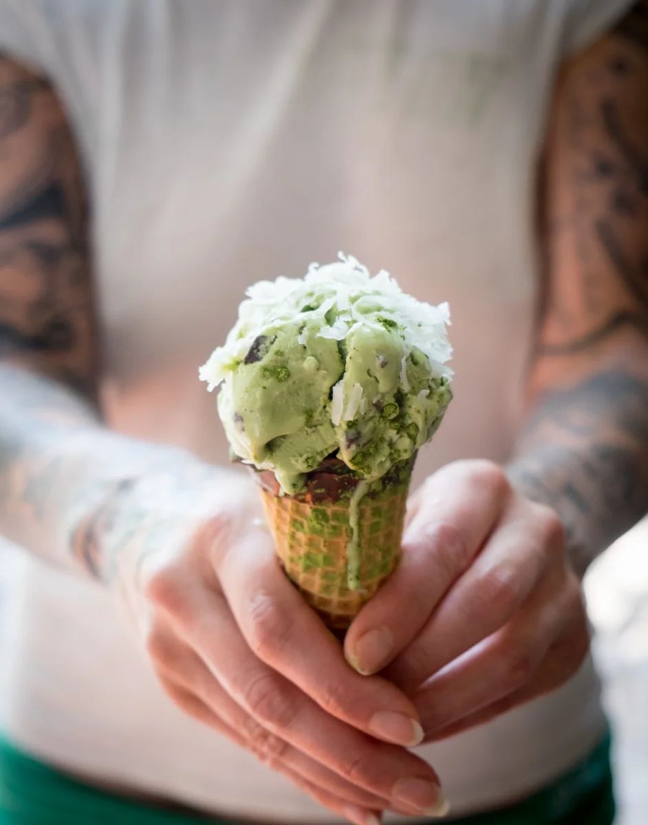 Coconut Mint Matcha Chunk Ice cream Cone Hands.jpg