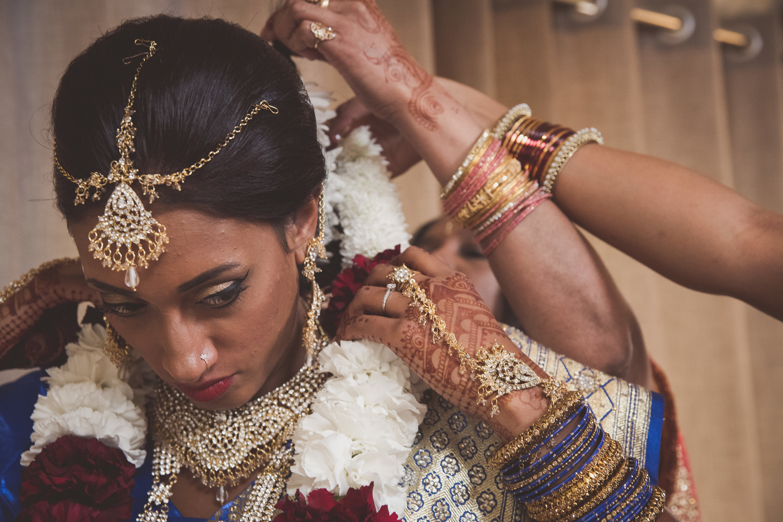 Hindu bride puts on garland for traditional Hindu wedding ceremony