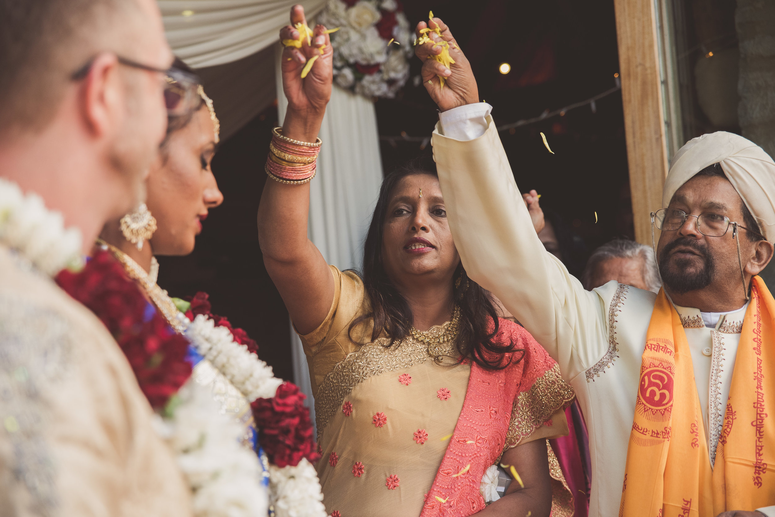 Throwing flower petals at Traditional Hindu wedding ceremony 