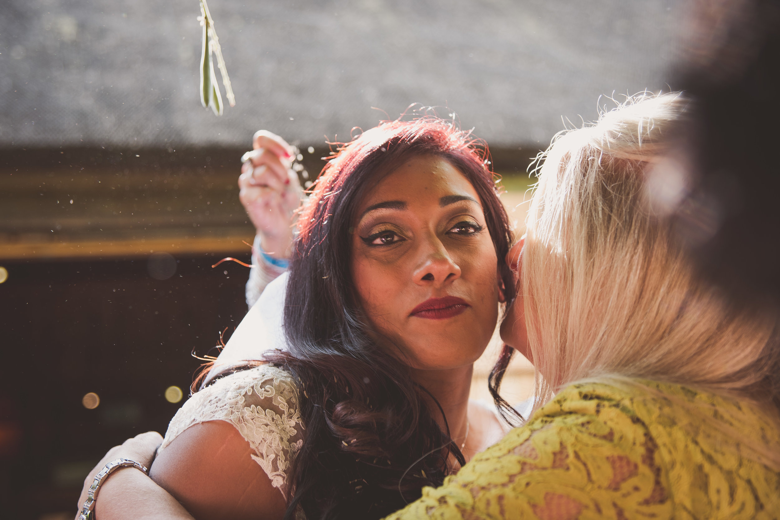 Guests kiss and congratulate bride