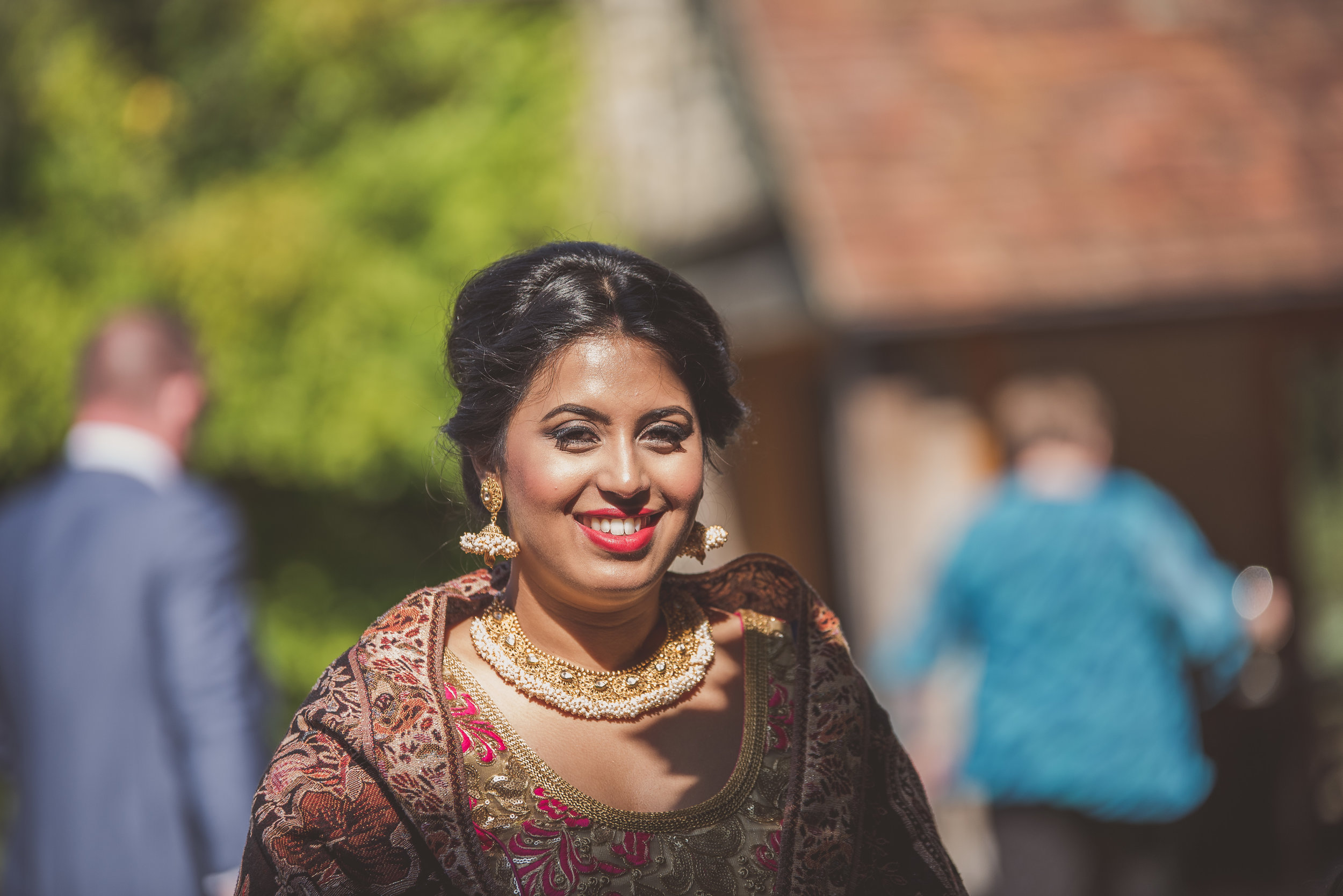 Wedding guest at Hindu wedding at Tythe Barn