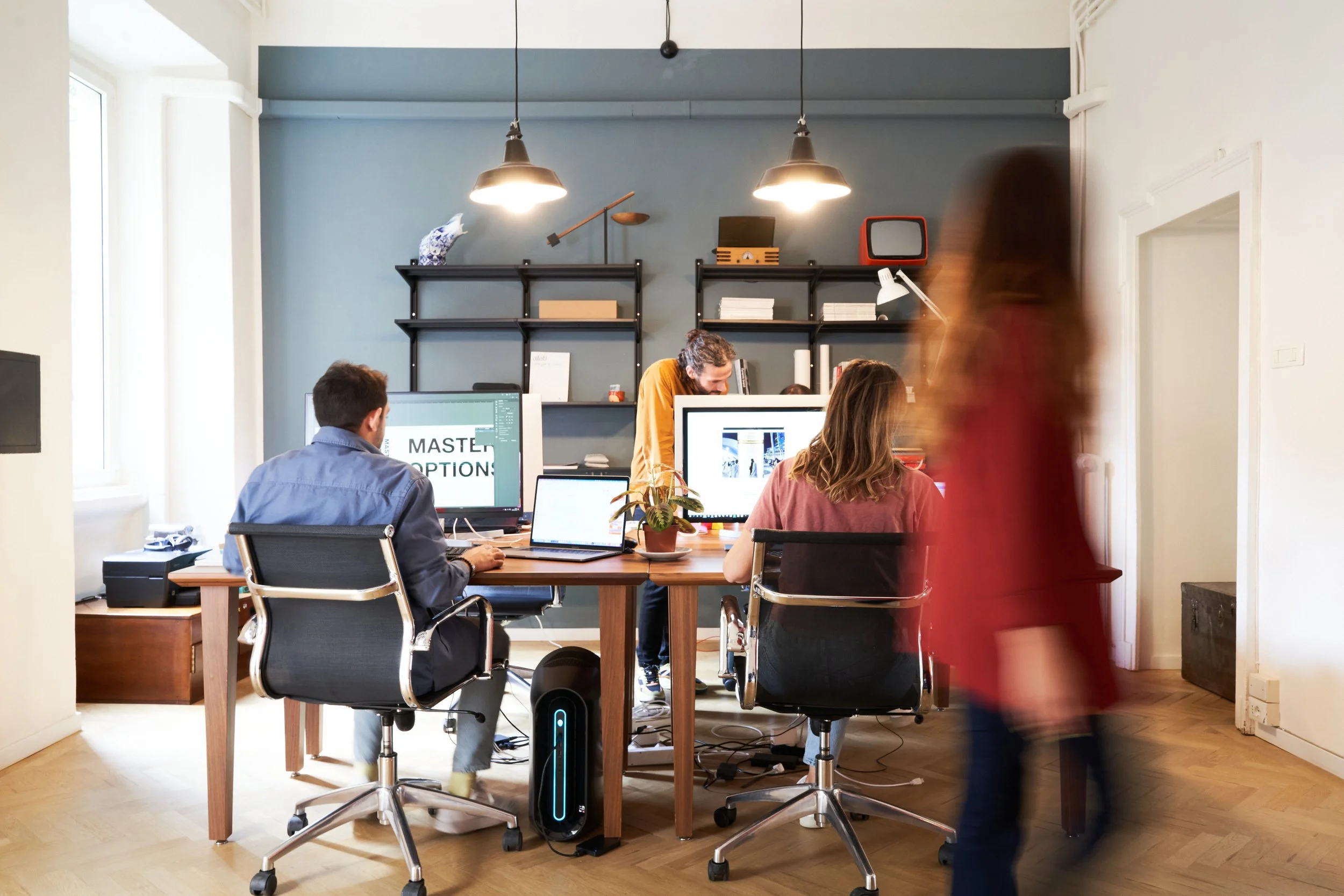Spaceagency Milan studio interior with designers working at desks.