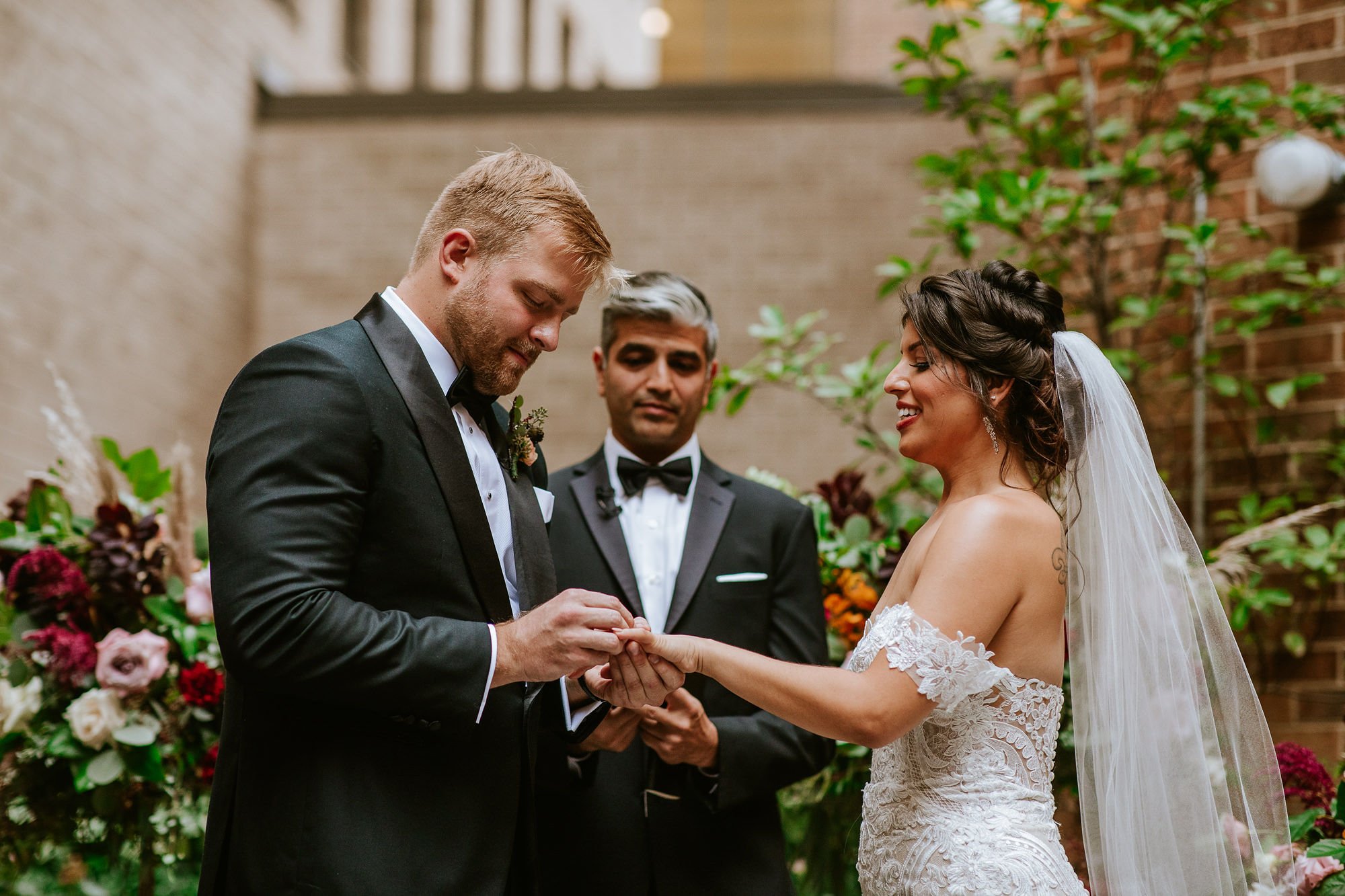 Groom putting on ring