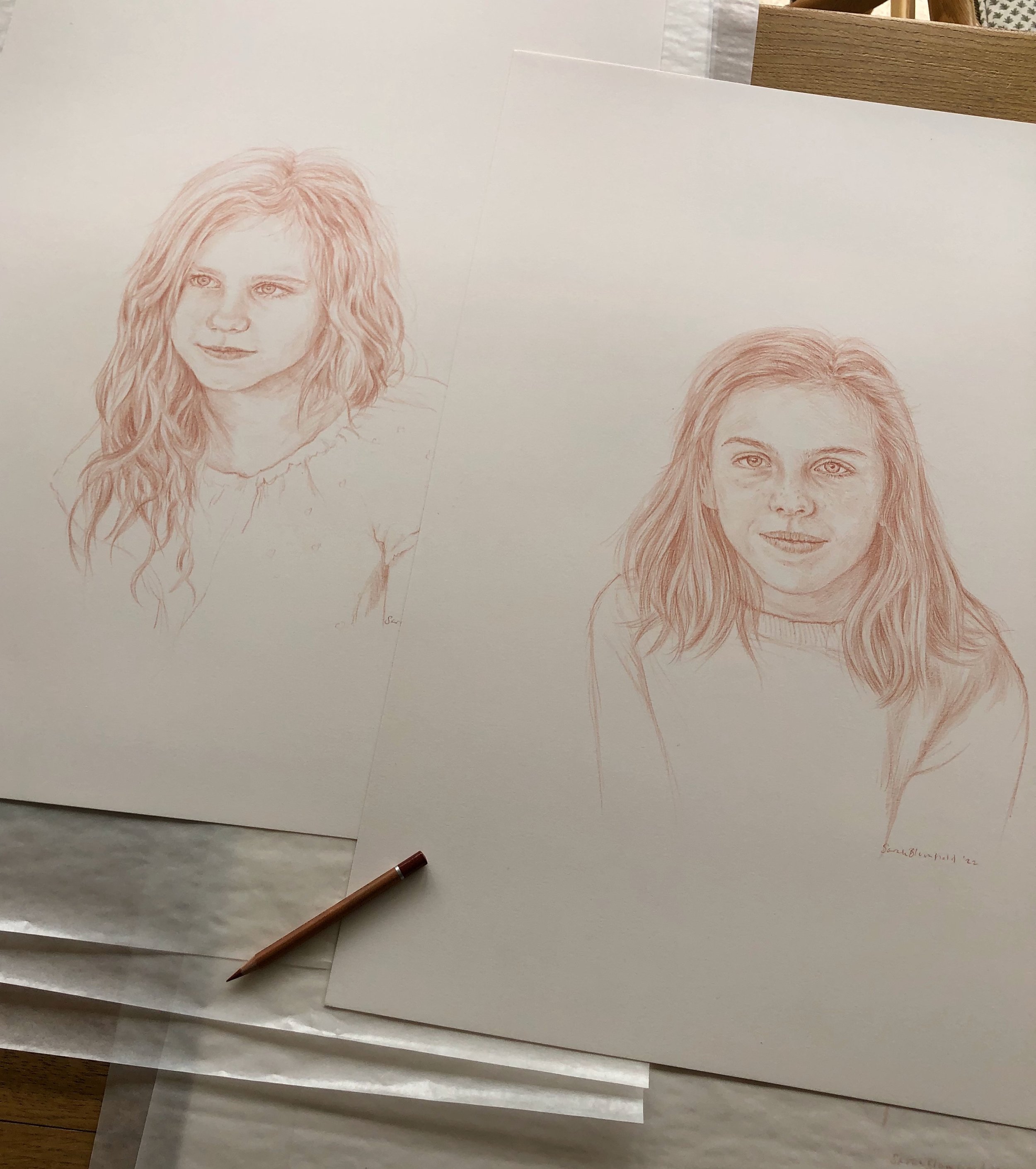 all pencil portraits are on off white paper, hard to photograph!