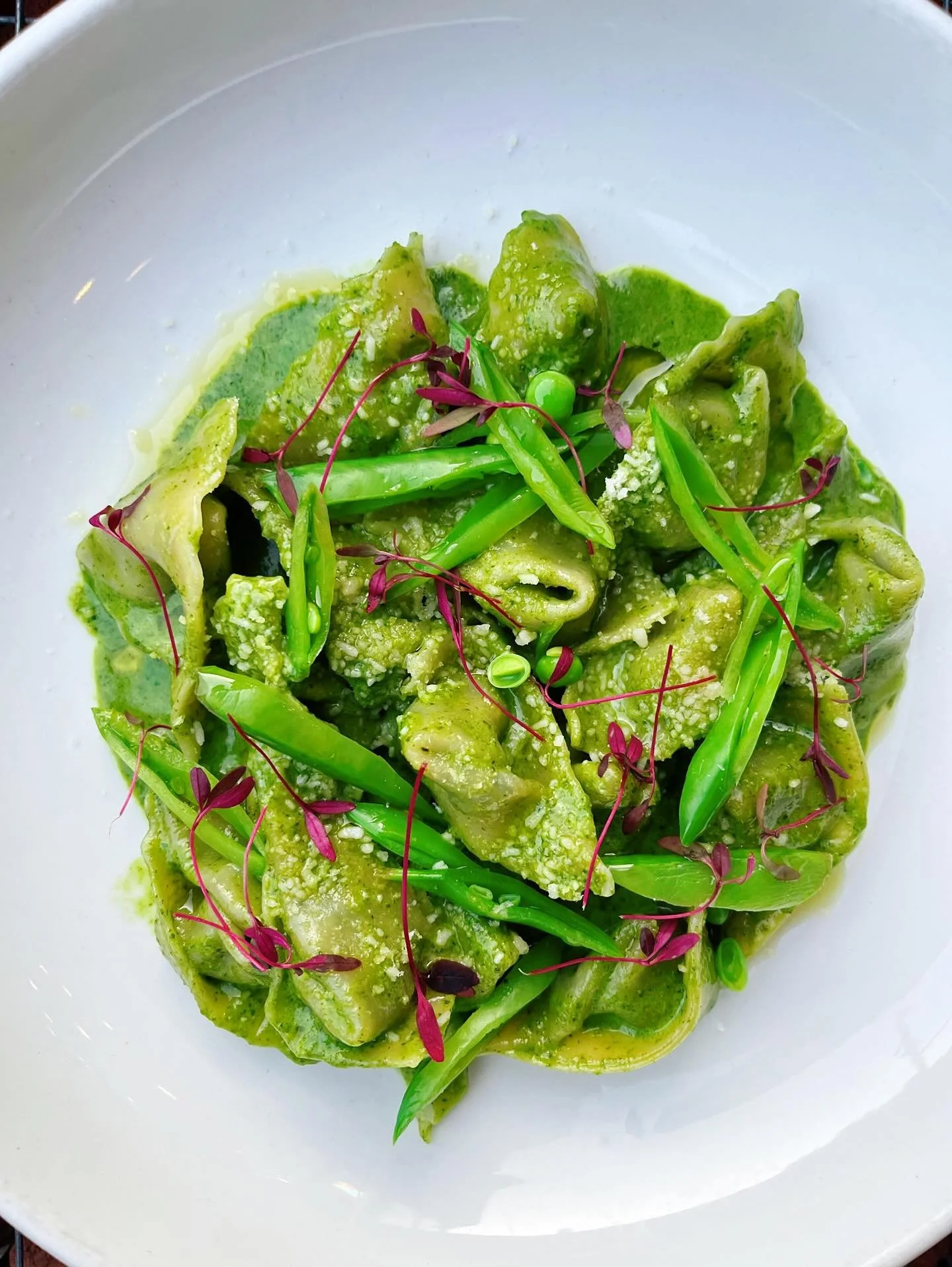 Tuesdays are still for ravioli, but now we also have a vegetarian-friendly special 🫛 Introducing the Tuesday Tortelli Verdi | goat cheese &amp; spinach filling, creamy basil pesto, sugar snap peas, parmigiano reggiano