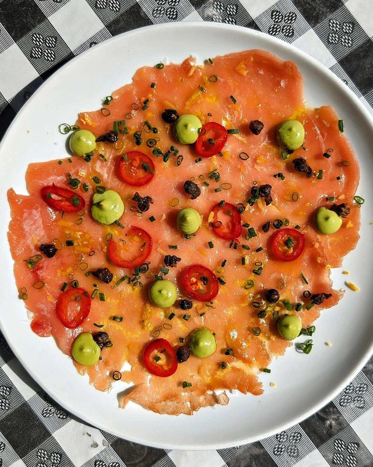Tuna Carpaccio | fresh, line-caught tuna, crispy capers, avocado crema, pickled chili 🎣 Available at both locations while supplies last