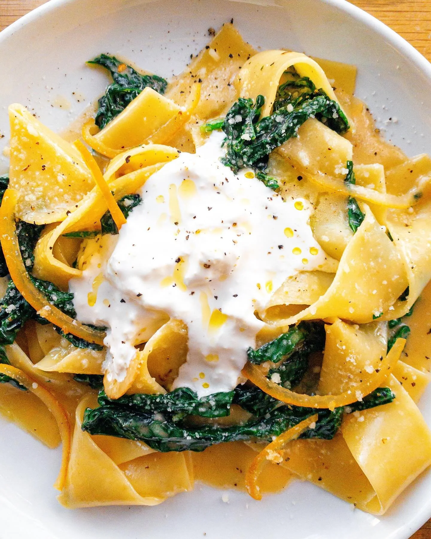Say hello to the new Chef&rsquo;s Pasta and every picture of pappardelle on my phone | Pappardelle | braised tuscan kale, lemon butter sauce, stracciatella, preserved meyer lemon 🍋 Happy national pasta day everyone 🍝