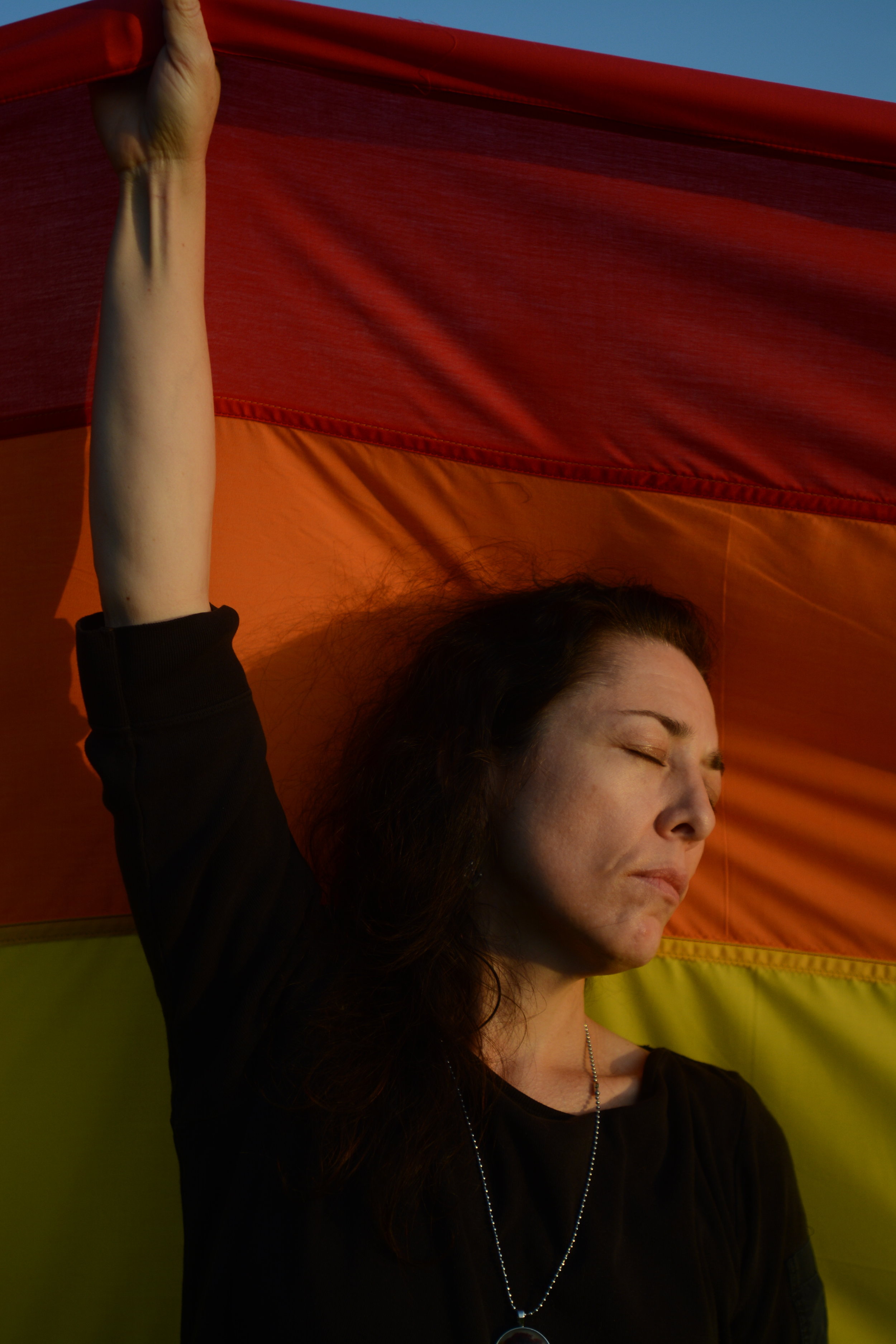  Carmelita Eggebrecht of Longwood, Florida, helps to hold up a 100 foot-long rainbow flag at the All Souls Catholic Church in Sanford, Florida, during the vigil of Luis Vielma, a victim of the Pulse nightclub shooting in Orlando. Eggebrecht and sever
