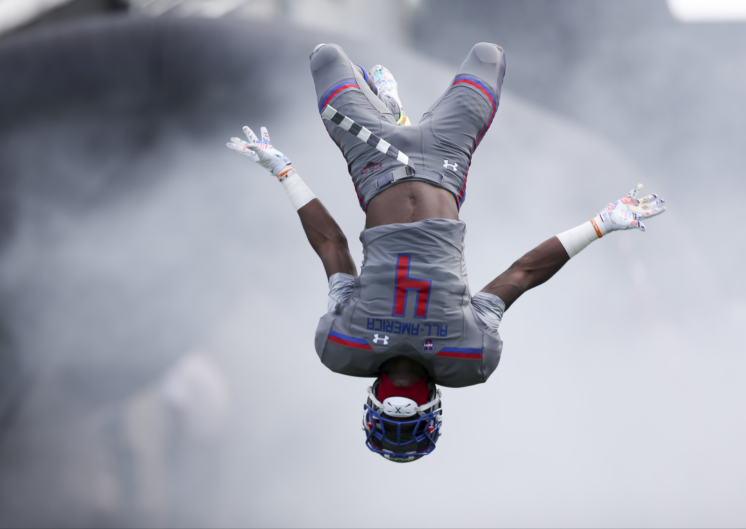  Team Armour offensive linebacker Maleik Gray (04) does a flip during the opening ceremony of the Under Armour All-America Bowl at Camping World Stadium in Orlando, FL. Final score: Armor 24, Highlight, 21. 