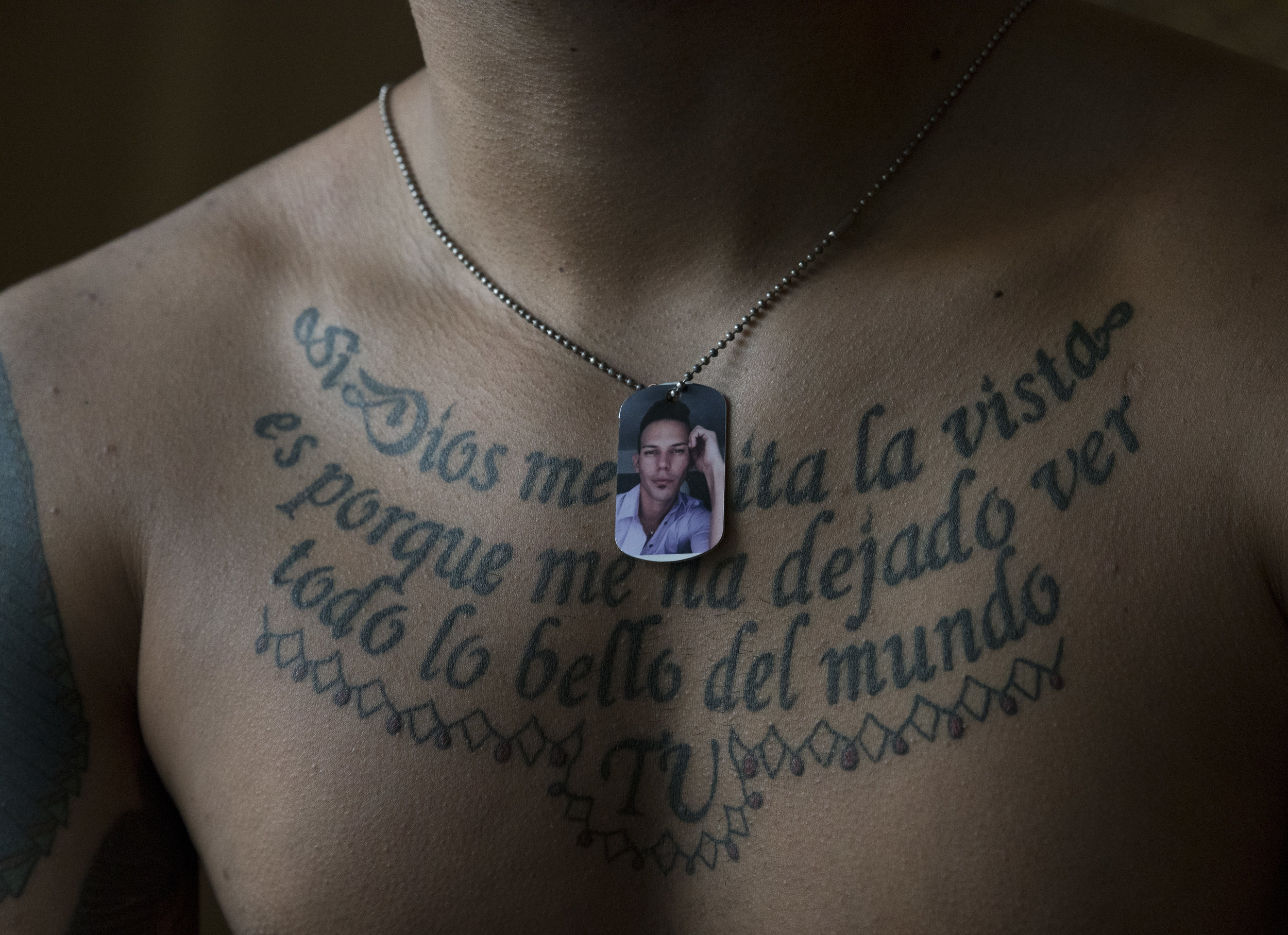  Michael Morales, 35, shows a tattoo and necklace he got in memory of Martin Benitez, his partner who was killed in the Pulse nightclub shooting. The text reads in Spanish: "If God takes my sight it's because he's allowed me to see all of the beauty 