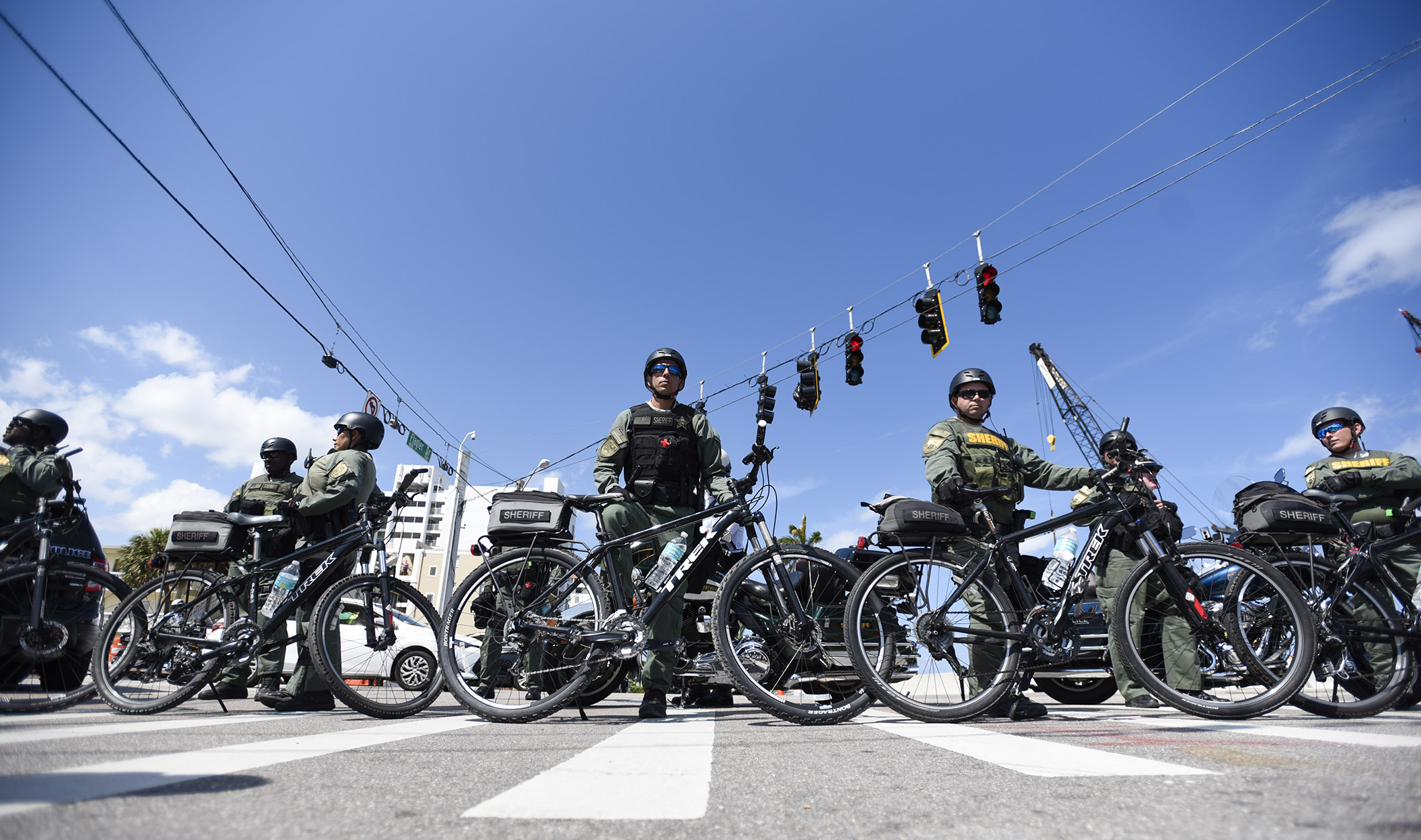  Palm Beach County Sheriff Office bicycle deputies are lined up at the corner of Southern Boulevard and South Flagler Drive during the March for Our Lives demonstration in West Palm Beach, FL. 