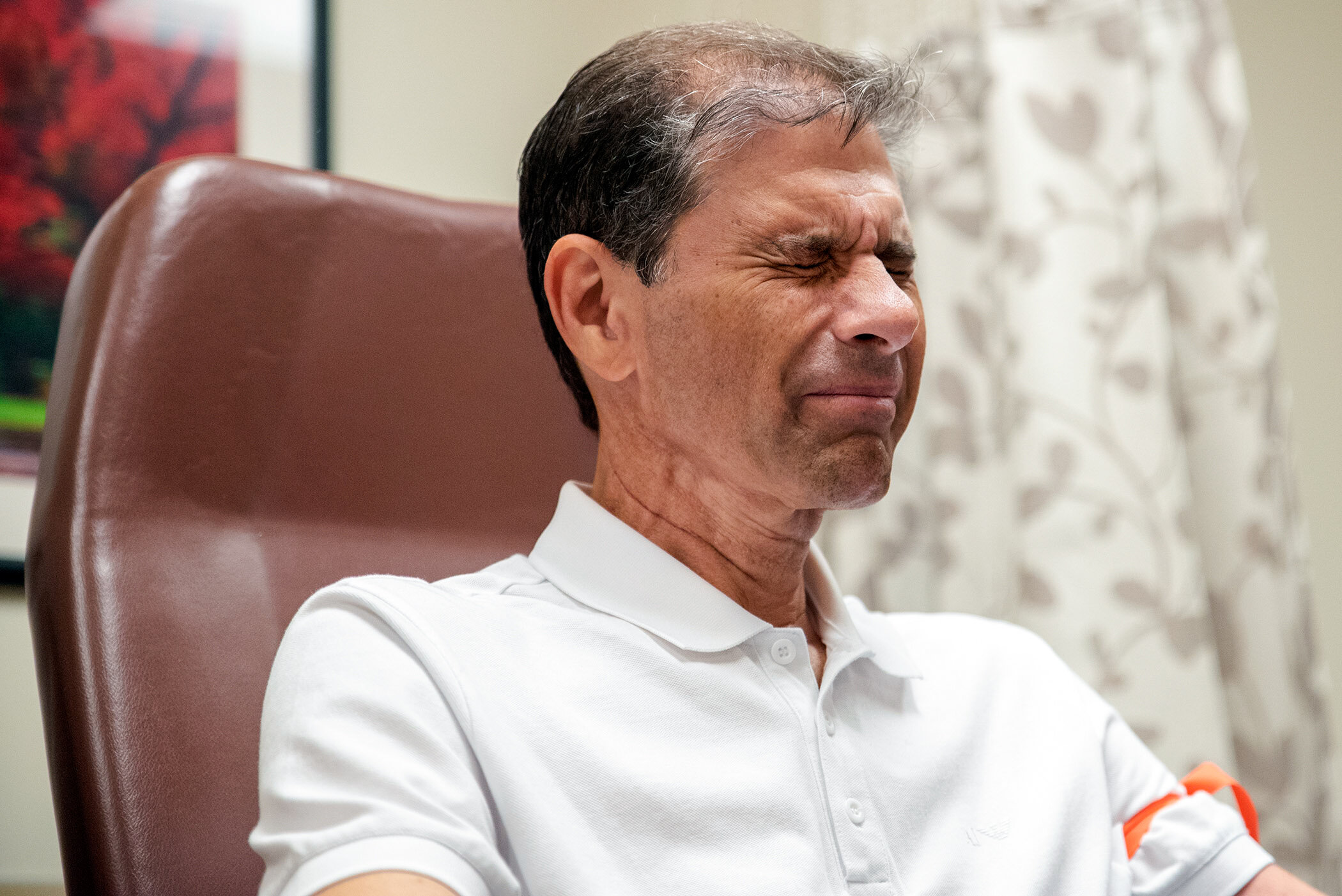  Tendler grimaces while a nurse draws blood. 